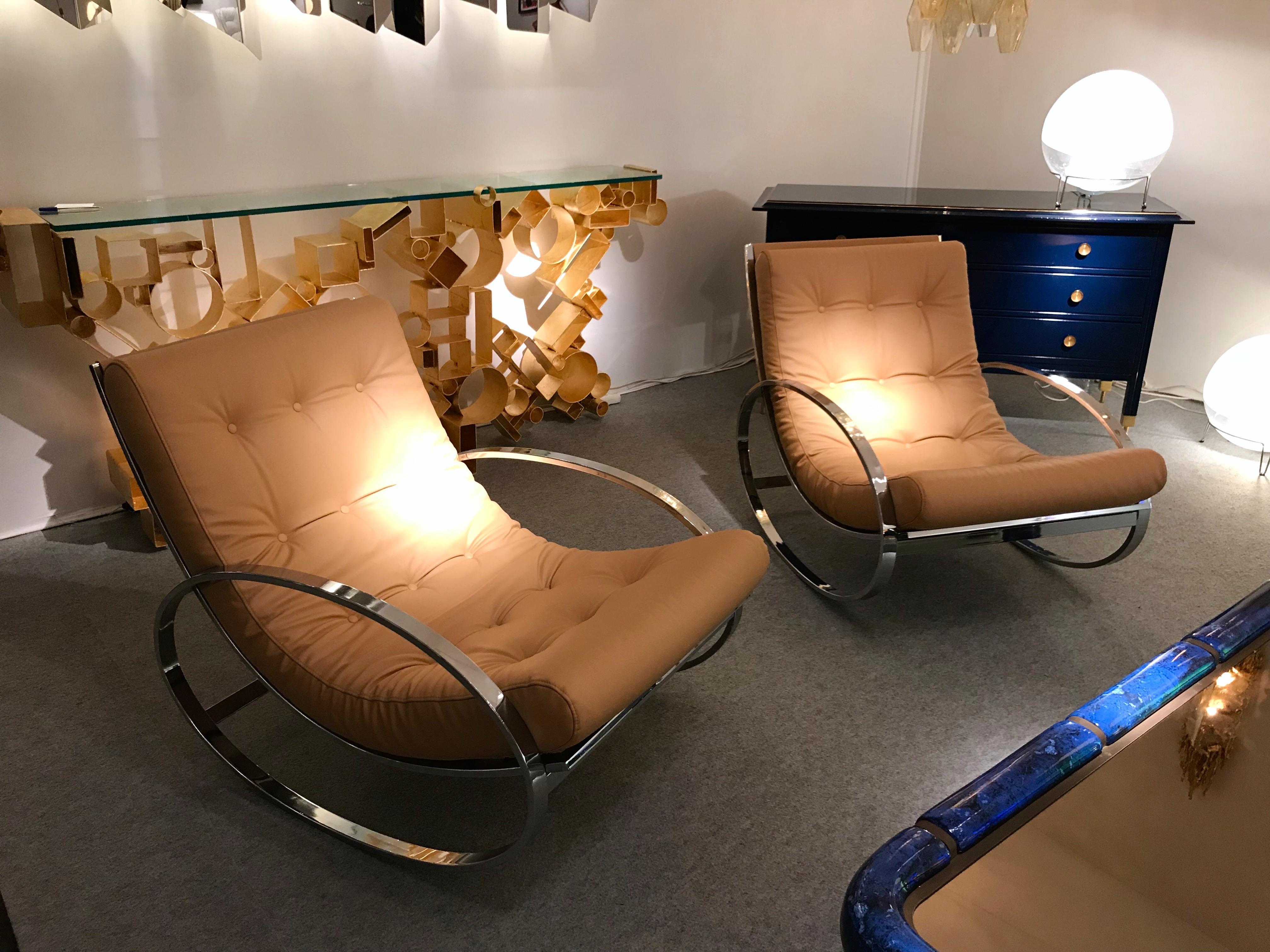 Pair of rocking chair or lounge armchairs by the designer Renato Zevi for his edition Zevi international. Metal chrome, fully upholstered with a very nice full grain leather. Famous design like Gio Ponti, Gianfranco Frattini, Cassina, Osvaldo