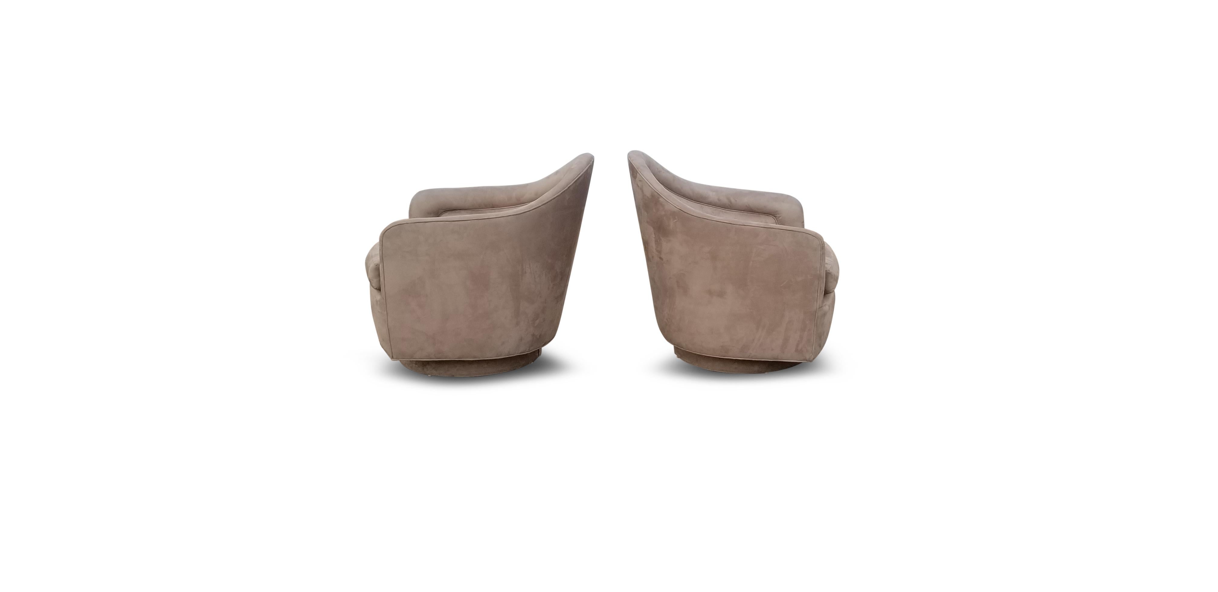 Pair of rocking swivel lounge chairs by Milo Baughman.