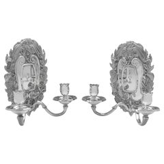 Pair of rococo Britannia standard silver wall lights made by Asprey in 1955
