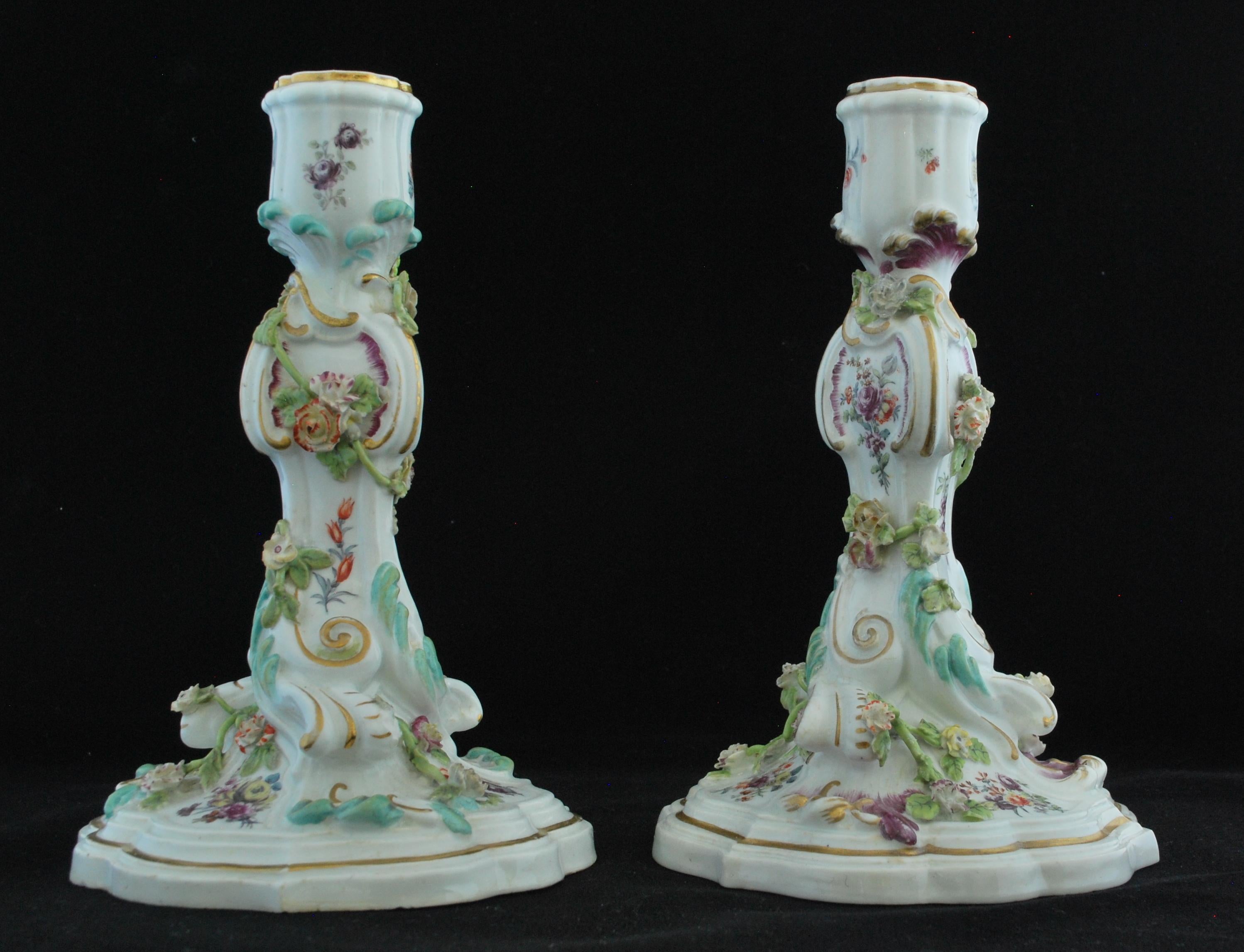 A fine pair of Rococo candlesticks, decorated with painted flowers and gilding.

Gold anchor mark.
 