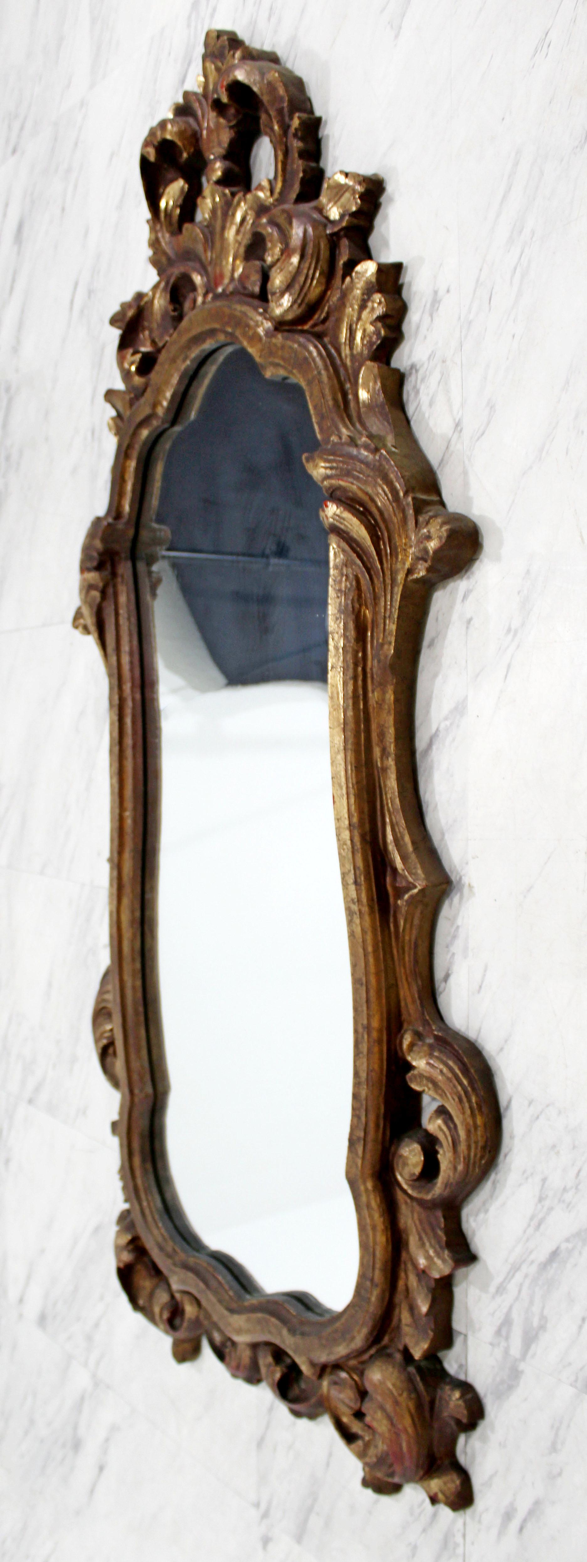 For your consideration is a wonderful pair of gold gilt leaf painted wood, hanging wall mirror. In excellent condition. The dimensions are 22