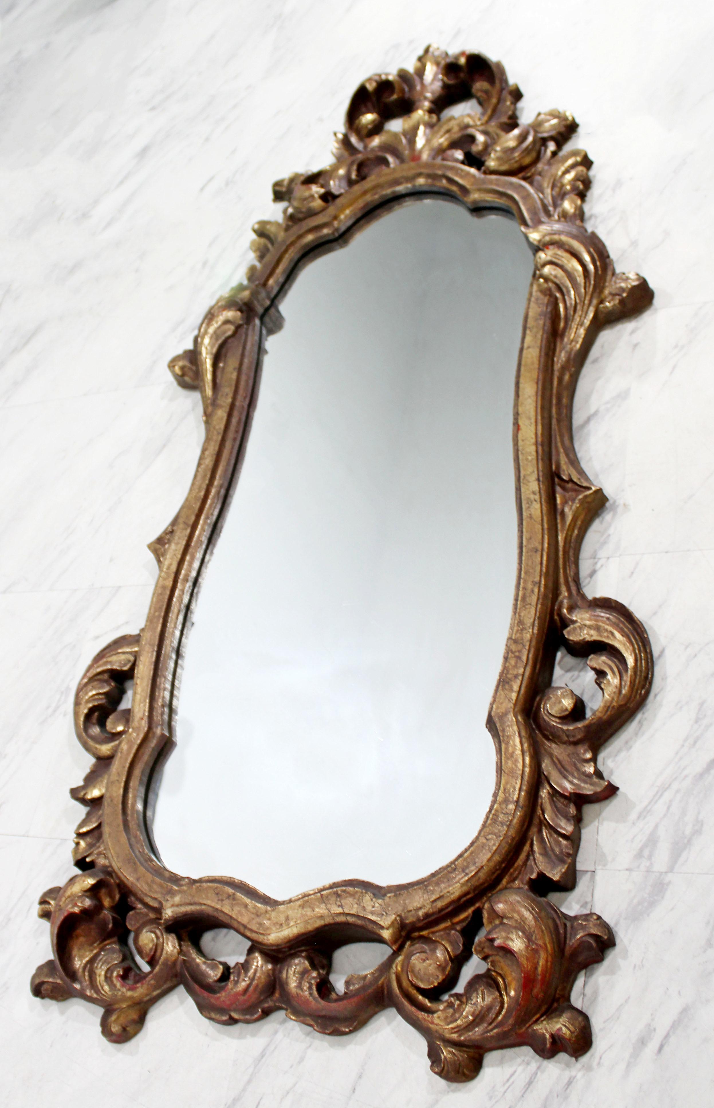 Pair of Rococo Hollywood Regency Style Gold Gilt Leaf Hanging Wall Mirrors In Good Condition In Keego Harbor, MI