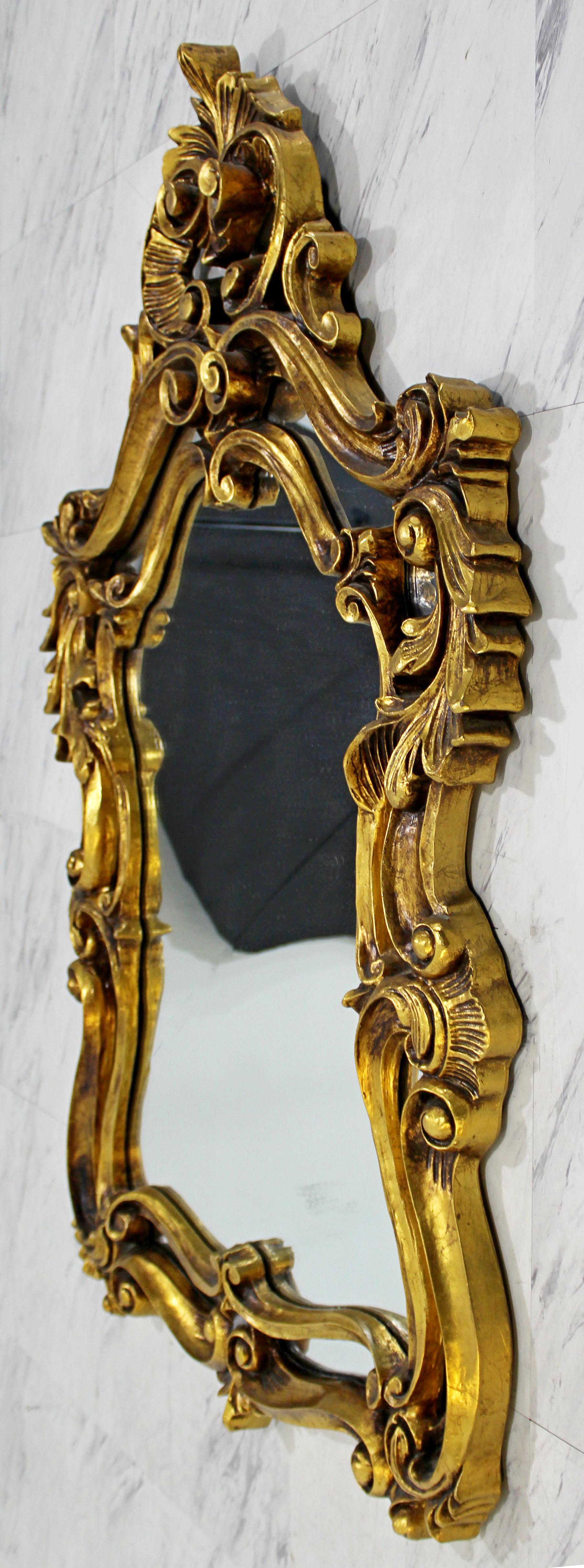 Pair of Rococo Hollywood Regency Style Gold Gilt Leaf Hanging Wall Mirrors In Good Condition In Keego Harbor, MI
