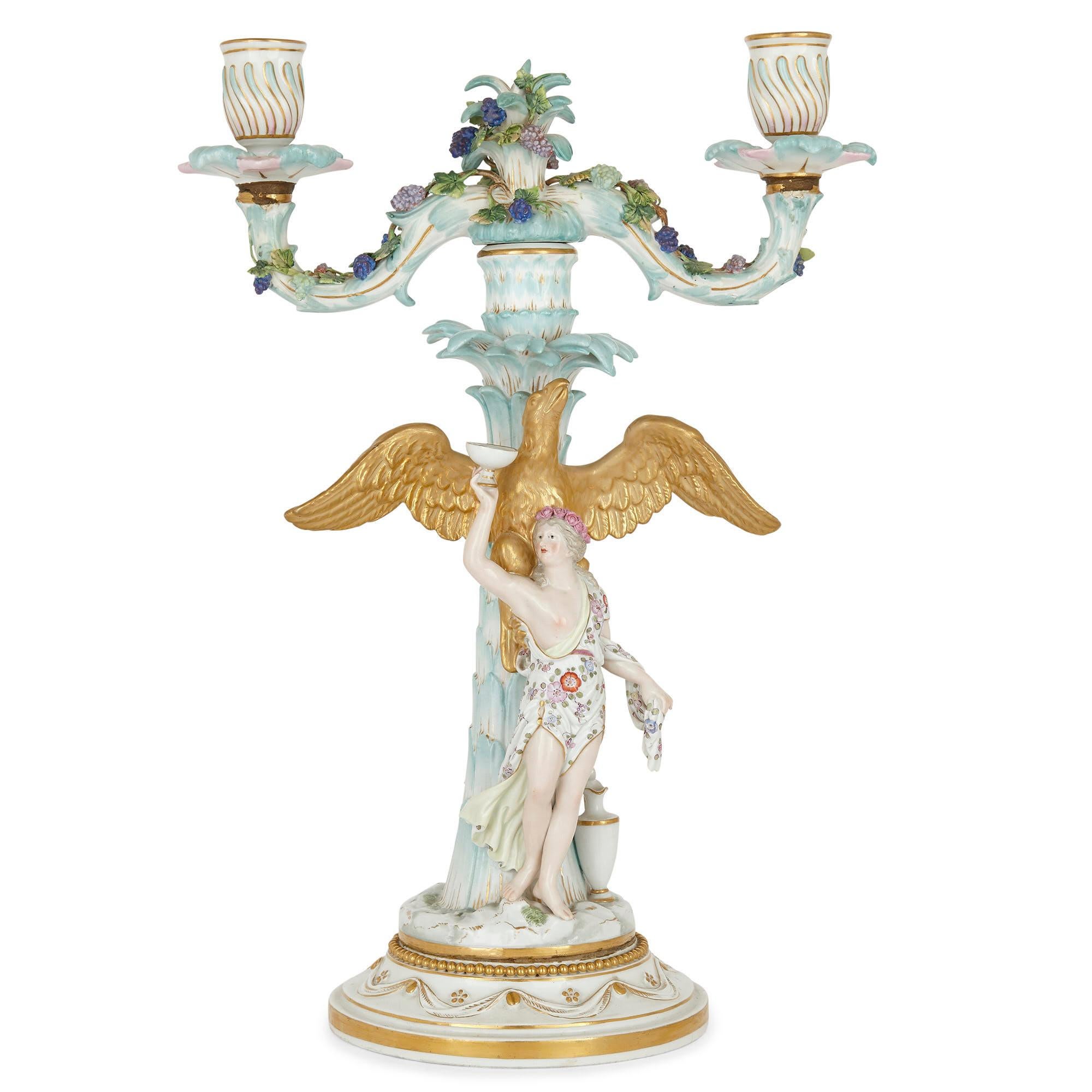 Pair of Rococo style German Meissen Porcelain candelabras
German, circa 1860
Measures: Height 37cm, width 26cm, depth 15cm

Rococo-style detailing, including figures representing Ganymede and Hebe, animals, urns, and floral motifs, abound in