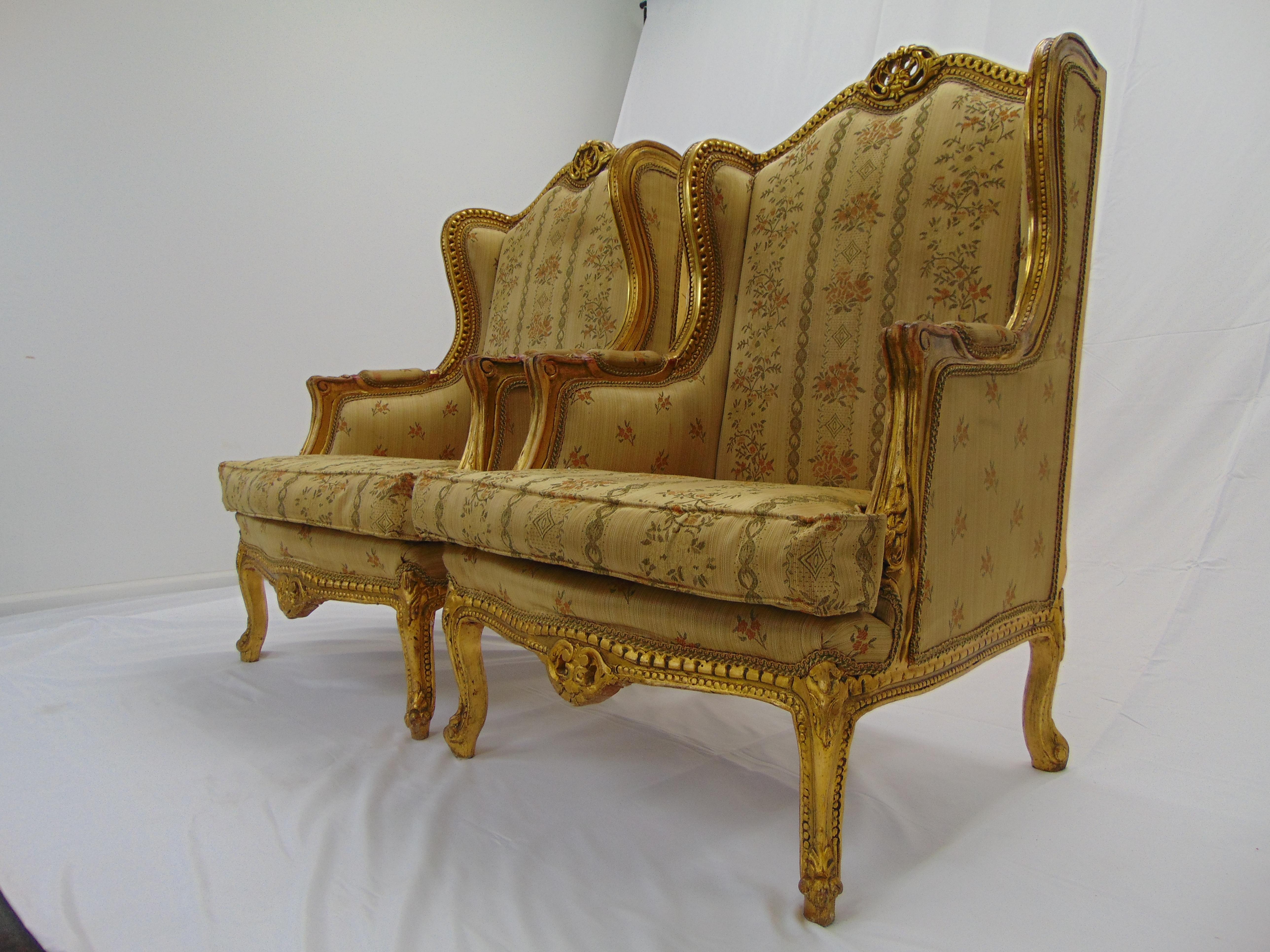 Unknown Pair of Rococo Style Vintage Wingback Gold Gilt Hand Carved Chairs For Sale