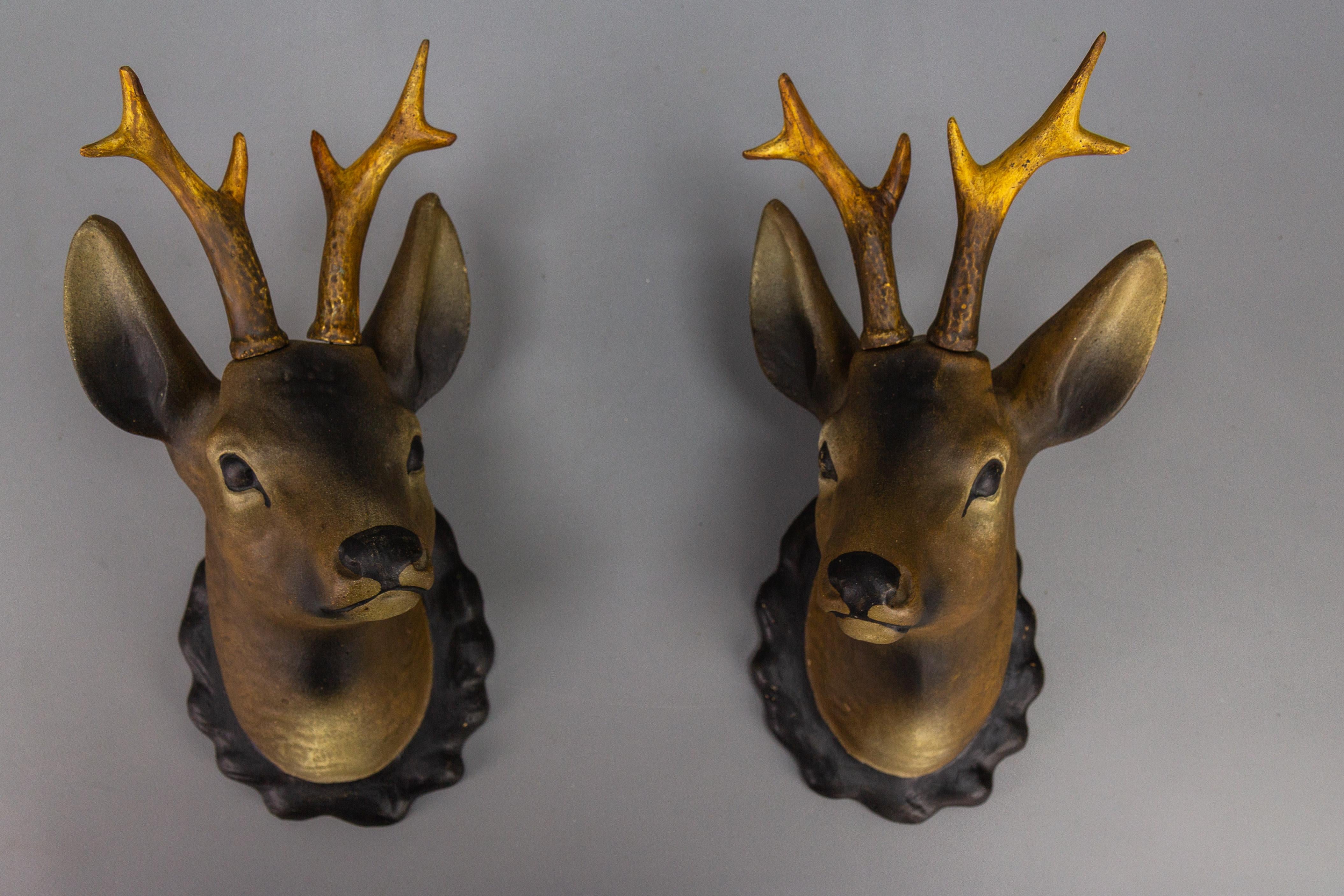 Roe deer heads, wall decoration, made of plaster, Germany, 1930s, set of two.
An absolutely adorable pair of roe deer heads in the Black Forest style is made entirely of plaster and hand-painted in brown and black colors. The antlers of both deer