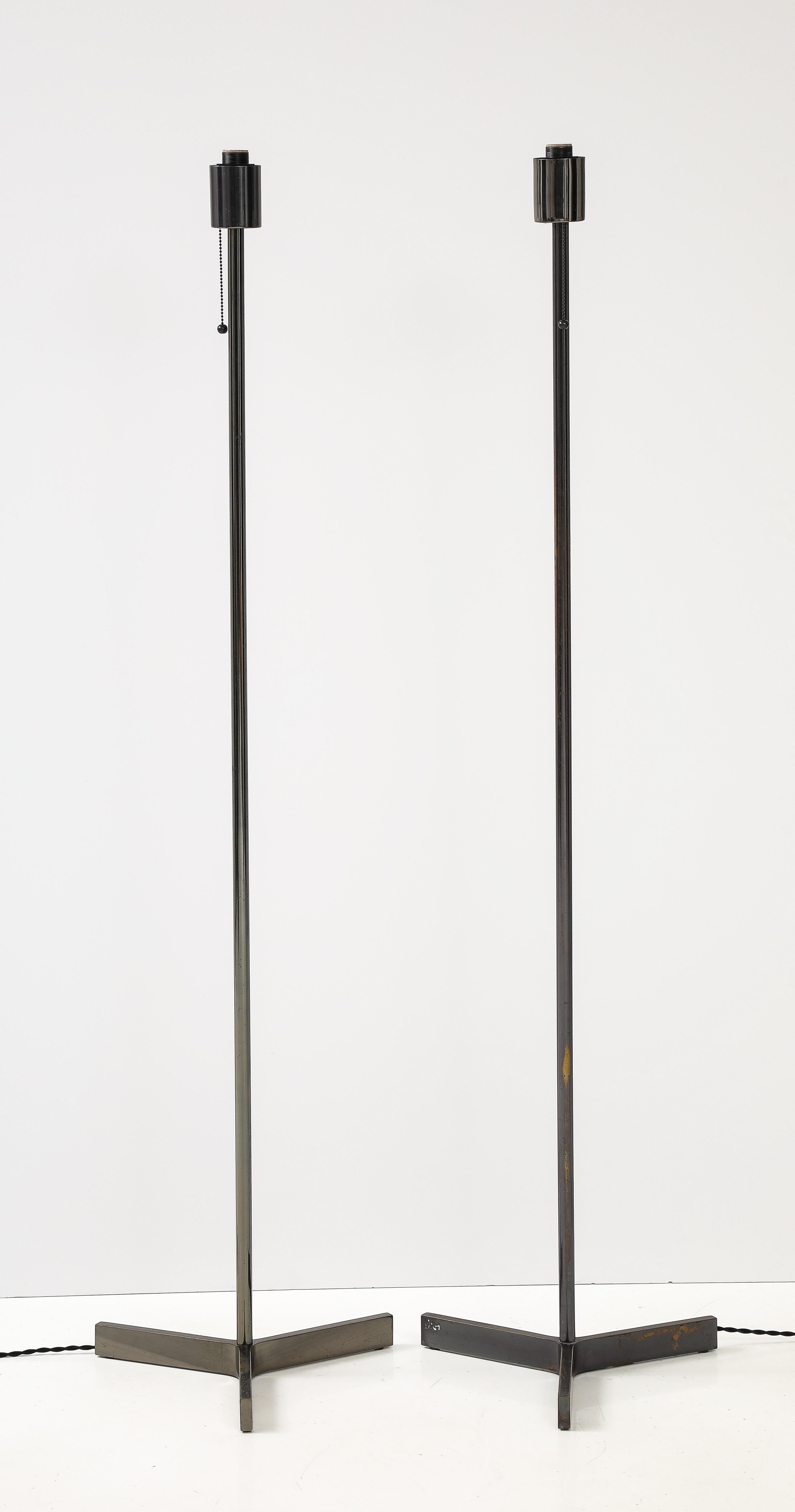May be sold individually.

These modern chrome floor lamps are made more beautiful by their age; small areas of patination to the metal place them in the 60s and bring warmth to the design, disrupting the clean lines and shining finish.

These lamps