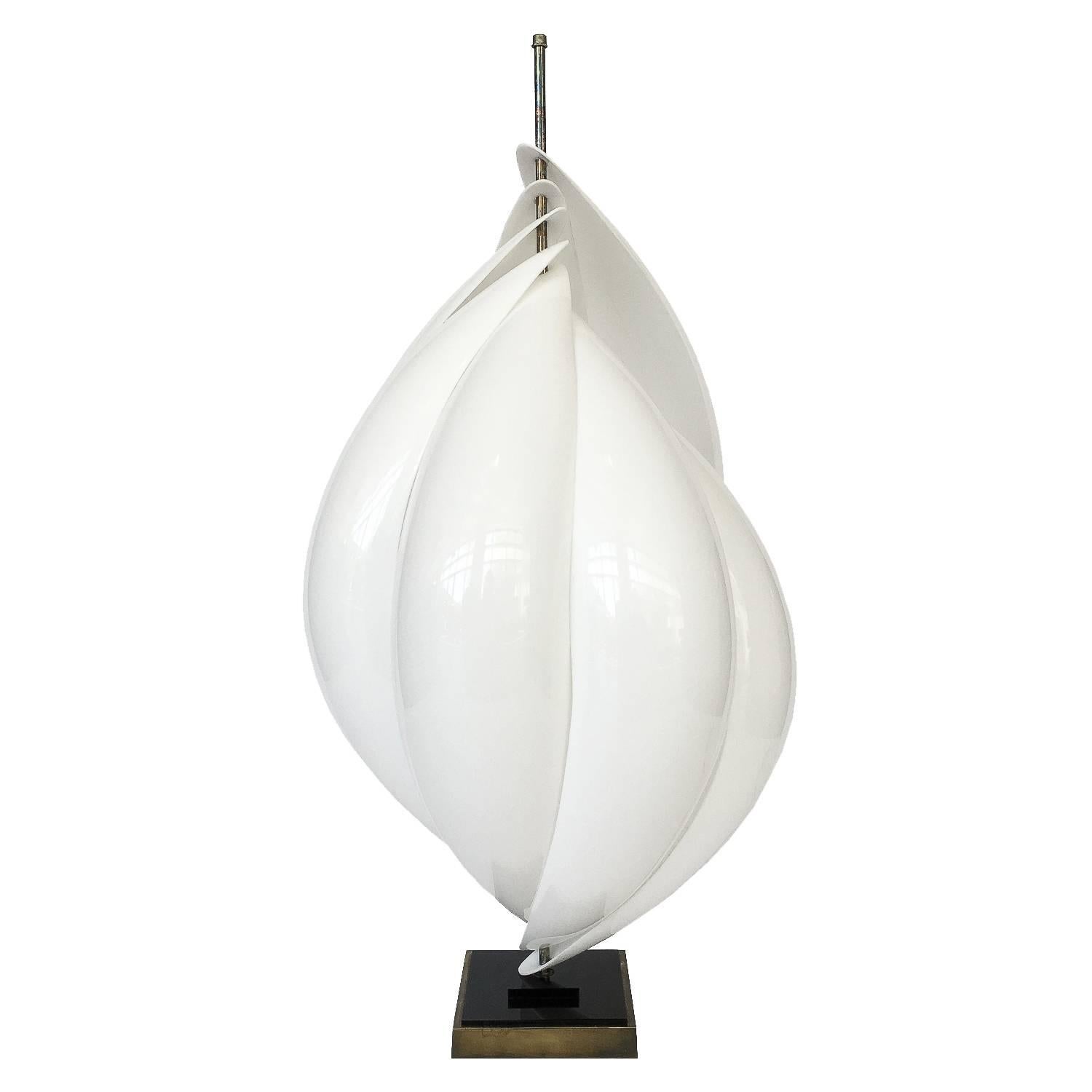 Pair of Roger Rougier sculptural white acrylic twisting table lamps. These large table lamps consist of seven overlapping white acrylic petals creating a modern shell-like or pod-like form. This pair is opposing spiralling forms. Brass plated bases