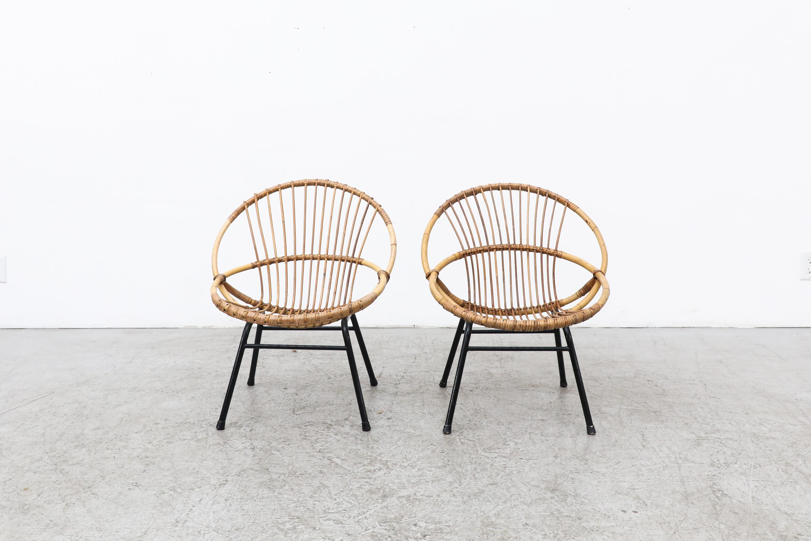 Pair of Rohe Noordwolde bamboo hoop chairs with black enameled metal frames. In original condition with visible wear and patina, and minimal bamboo breakage. Wear is consistent with their age and use. Shown with bamboo side table (LU922432506772).