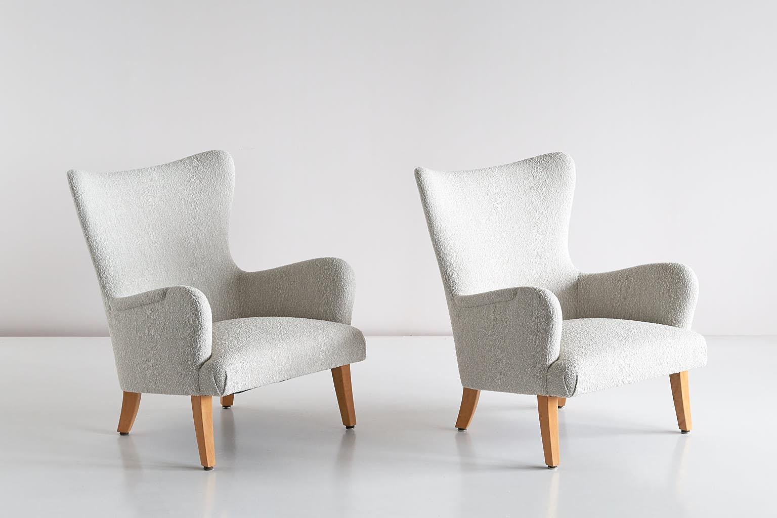 This rare pair of armchairs was designed by Rolf Engströmer for the Maria Husmodersskola in Stockholm, circa 1946. The round lines, the slanted seat and the curved, tapered sycamore legs give the design a gracious appearance.

The chairs have been