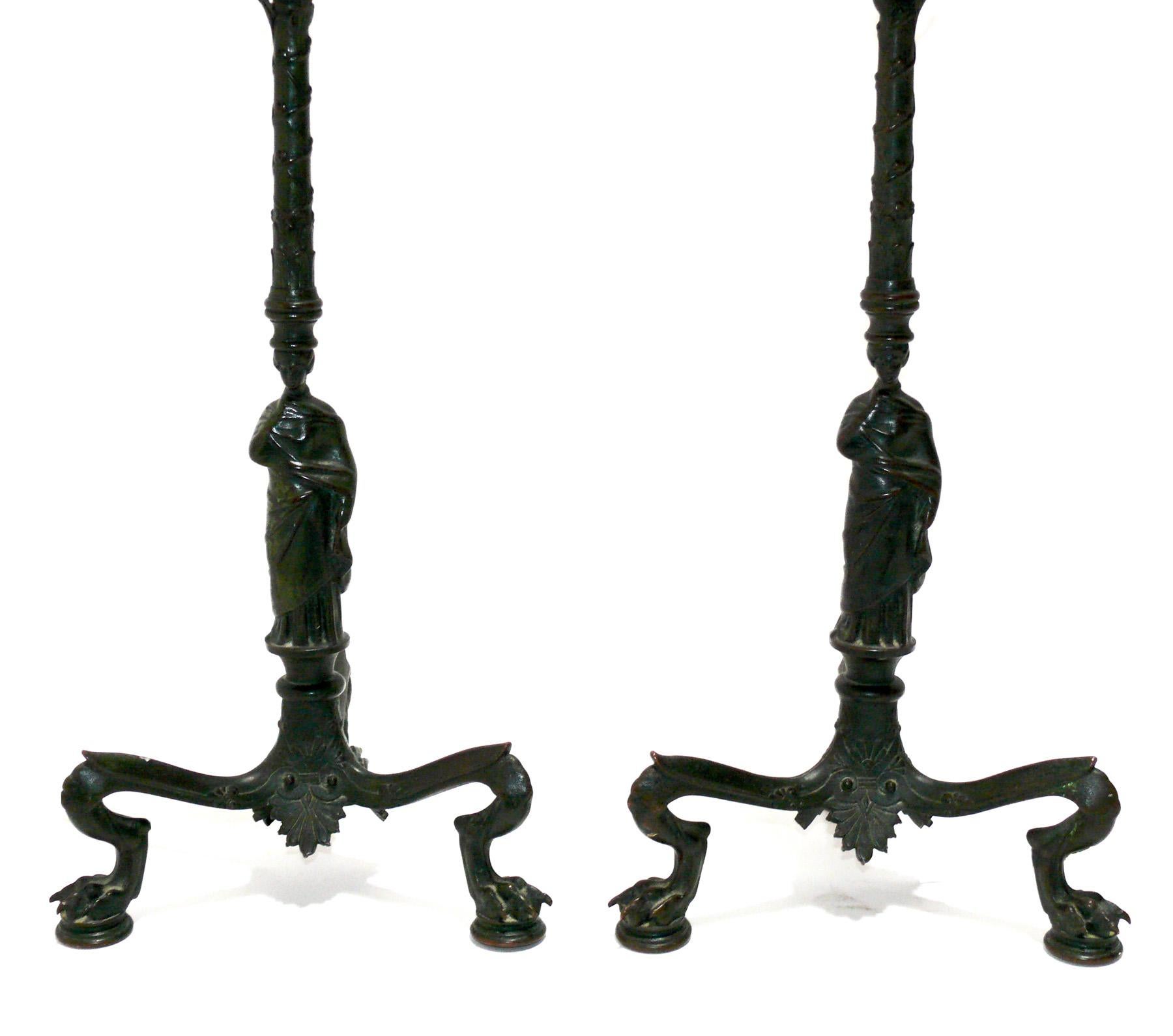 Pair of Roman bronze neoclassical lamps, probably French, circa 1920s. They retain their warm original patina. They have been rewired and are ready to use. The price noted includes the shades.
