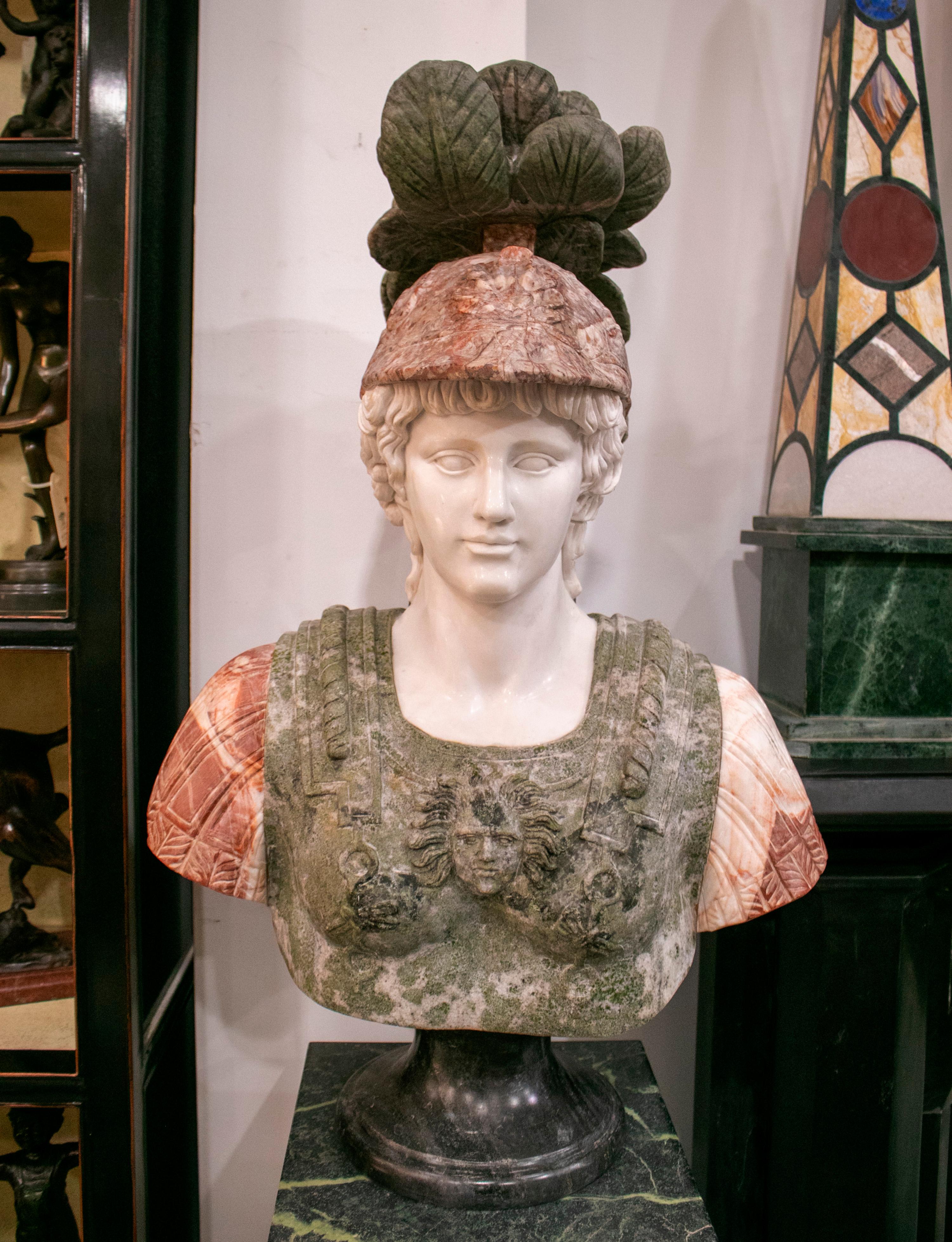 Pair of Roman hand carved busts using white Carrara, green serpentine, red Alicante marbles and standing on black Belgium marble bases.