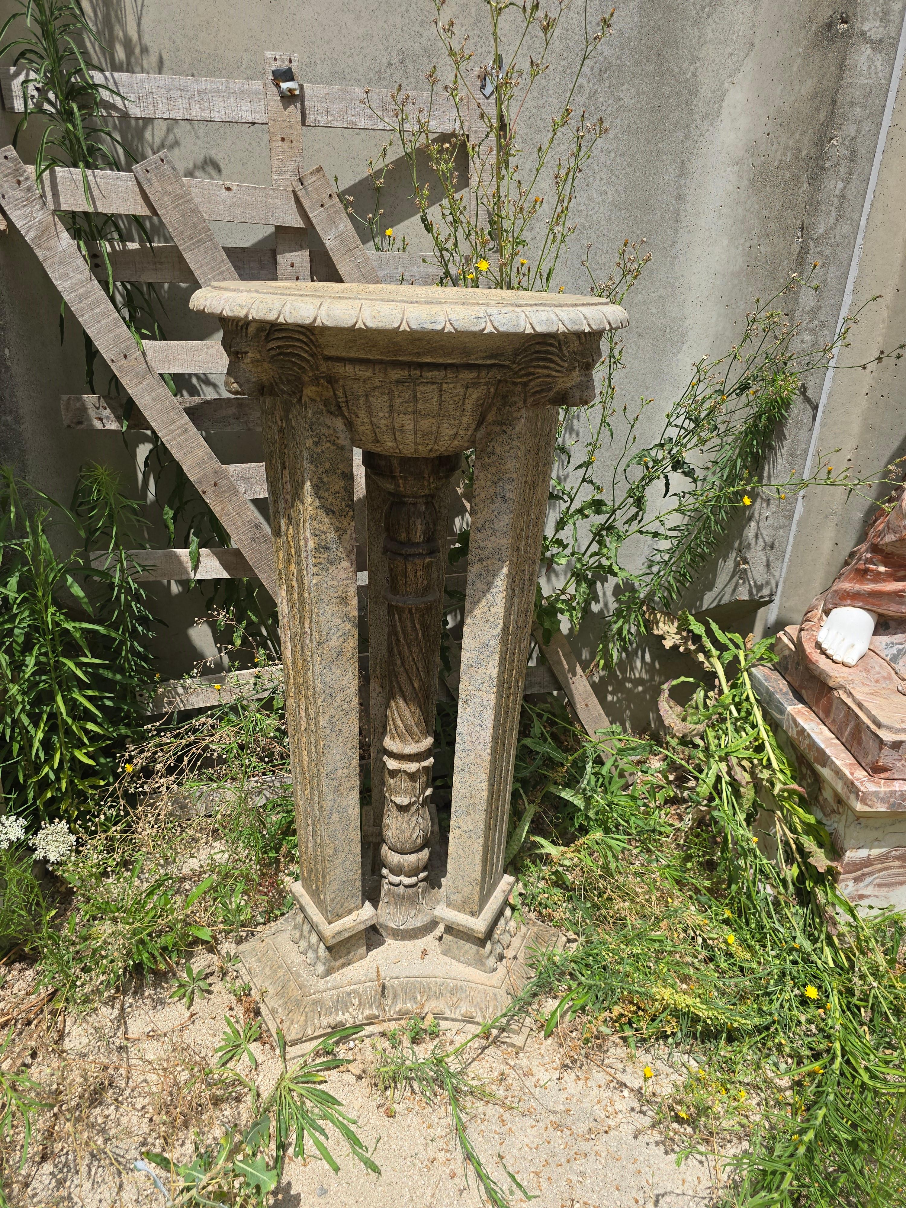 Elegant pair of Roman-style pedestals crafted from solid granite, made in Italy during the 1950s. Inspired by ancient Pompeian design, each pedestal features a classical cylindrical form with subtle fluting and a refined, architectural