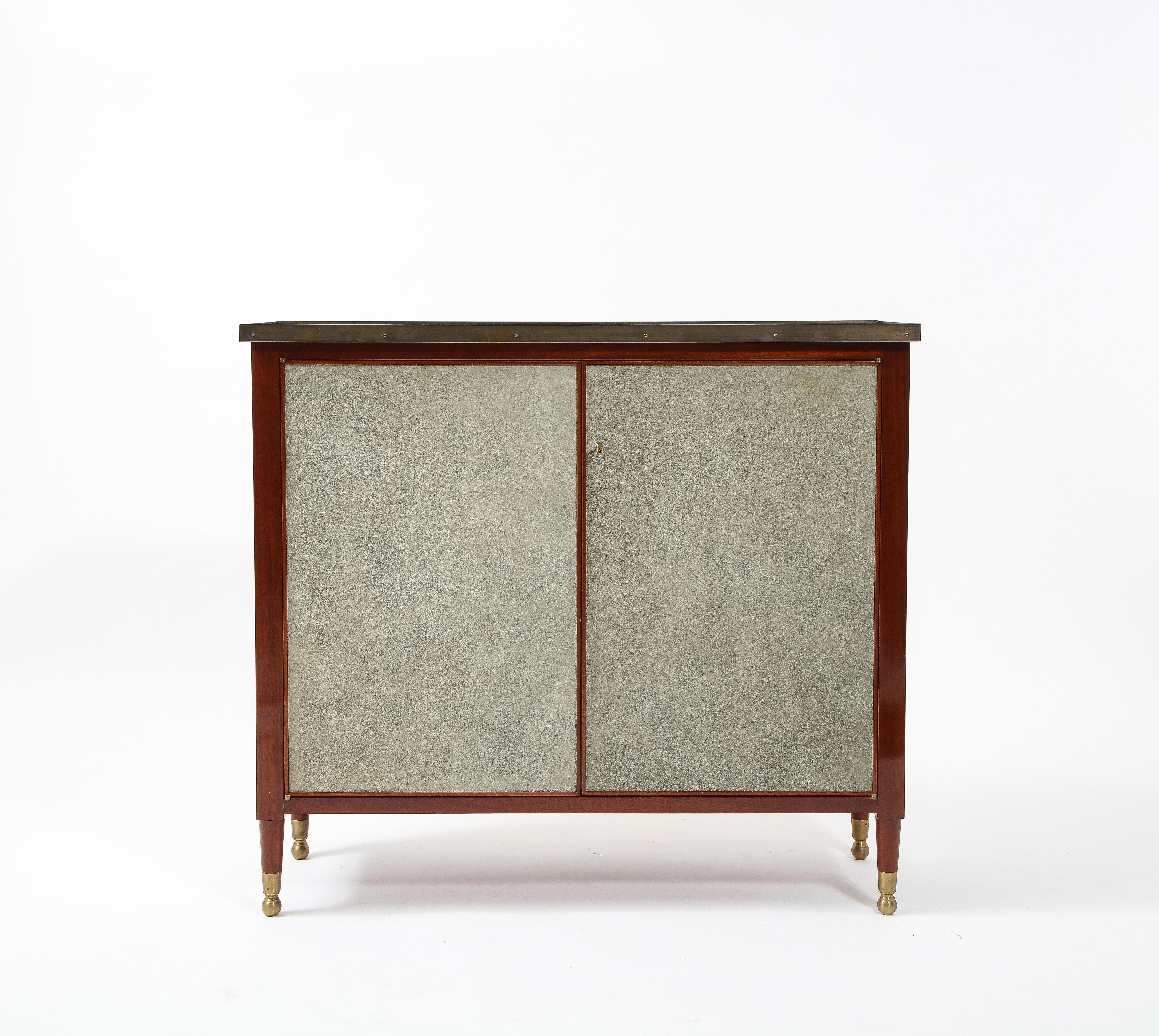 Handsome pair of classic cabinets. Made by the respective furniture house Roman Thomas.

Solid mix of materials, thoughtful details. Functional storage.

The cabinets can be purchased as a pair or individual singles. They are priced individually. 