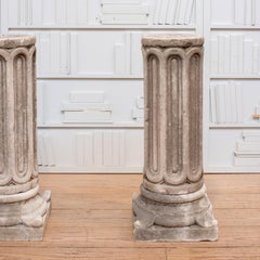 Pair of Romanesque Arched Form Carved Marble Pedestals