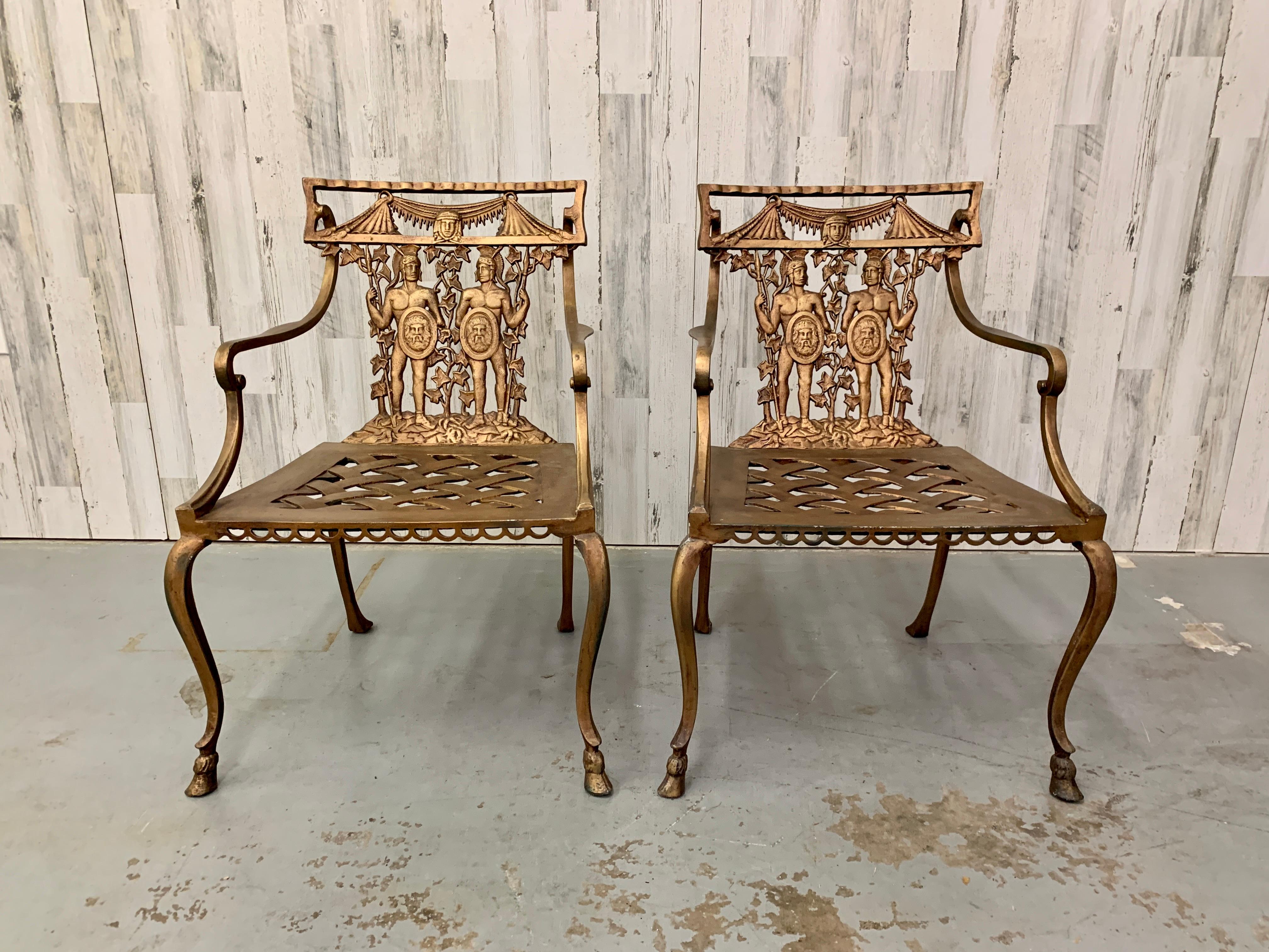 Cast metal patio chairs with Roman warriors in a gold bronze finish and basket weave seat made in Mexico Circa 1970s.