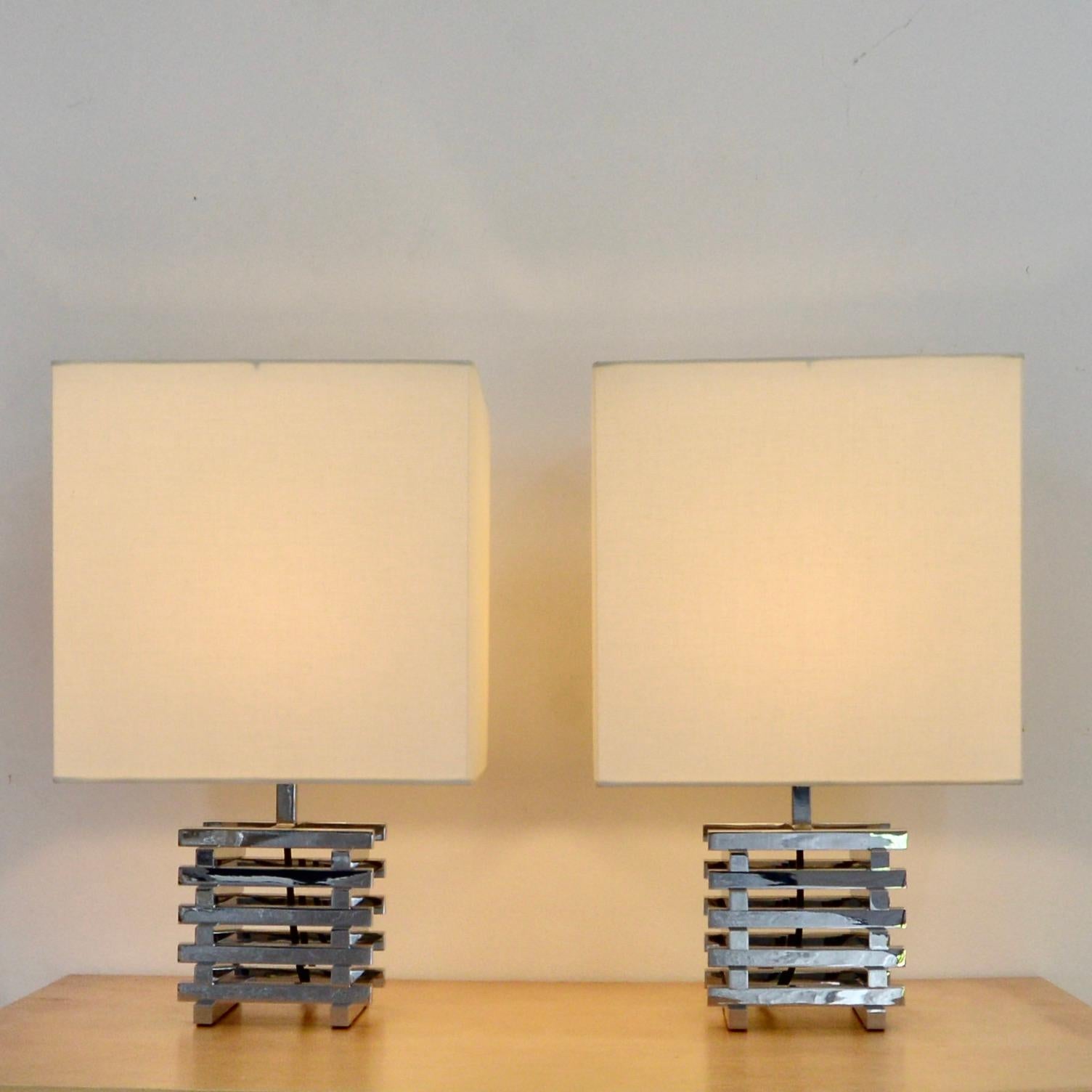 Pair of vintage Italian 1970s polished chrome and fabric table lamps by Romeo Rega. Fully rewired with a single E26 medium based socket per lamp, ready to be used in the USA. 
Measurements:
Height: 20”
Depth: 12”
Width: 12”.