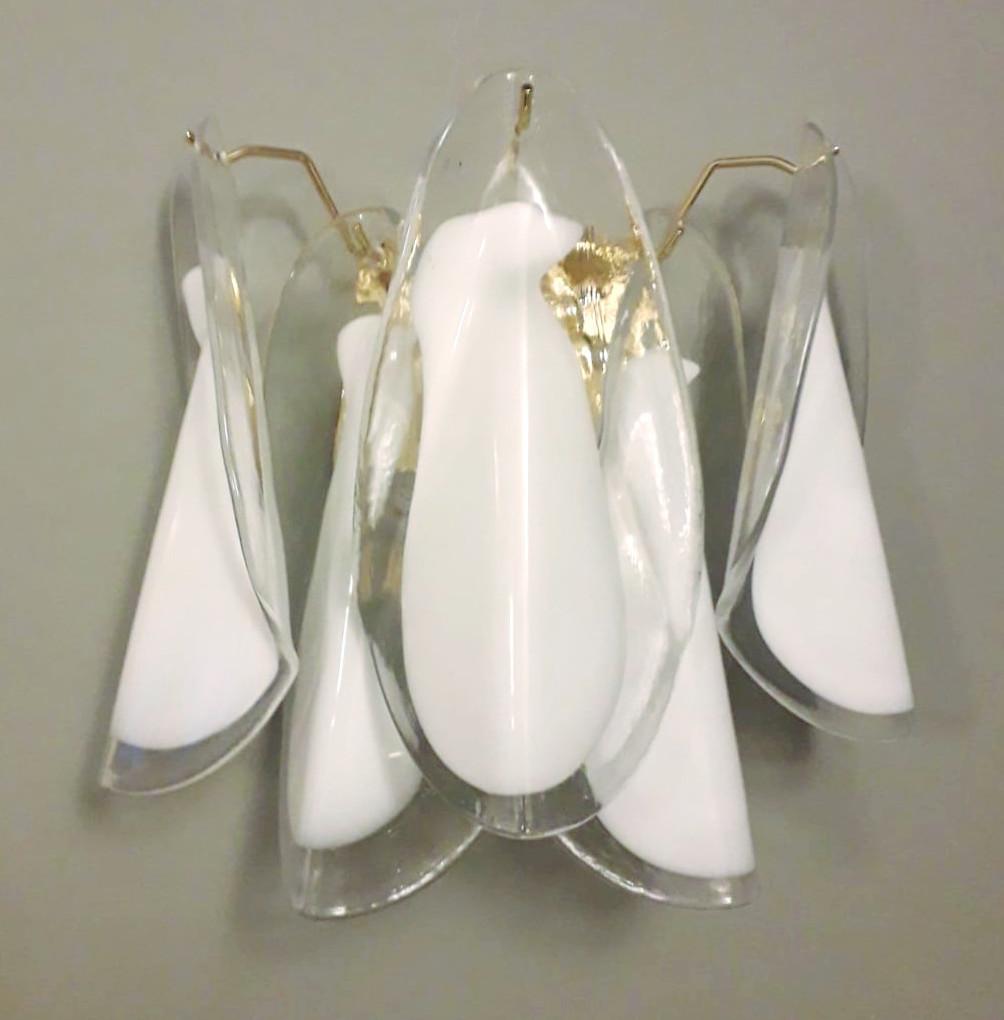 Pair of Italian wall lights with vintage milky white Murano glass petals, mounted on newly made gold finish metal frames / Made in Italy
Measures: height 12 inches, width 12 inches, depth 7 inches
2 Lights / E12 or E14 type / max 40W each
1 Pair
