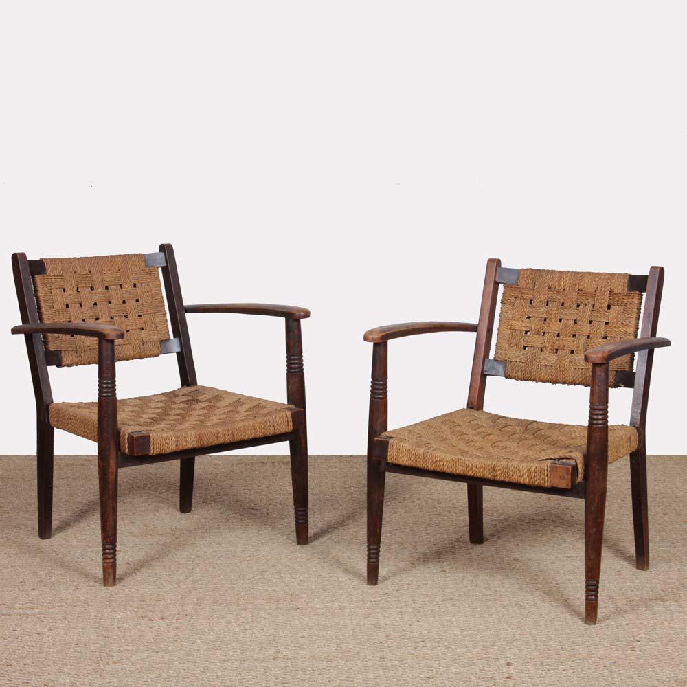 This pair of armchairs recalls the work of Adrien Audoux and Frida Minet. The frame is solid oak. Seat and back in rope. These vintage 1950s armchairs are in good original condition.