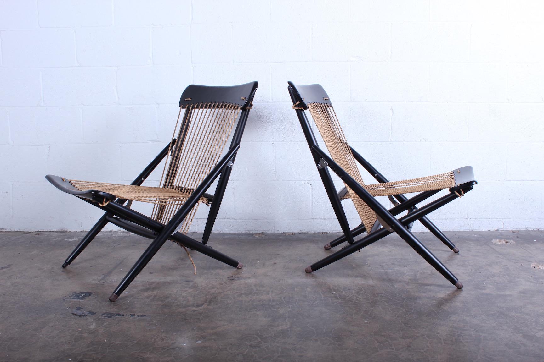 A beautiful pair of matching folding Maruni chairs. Wonderful condition with original rope.