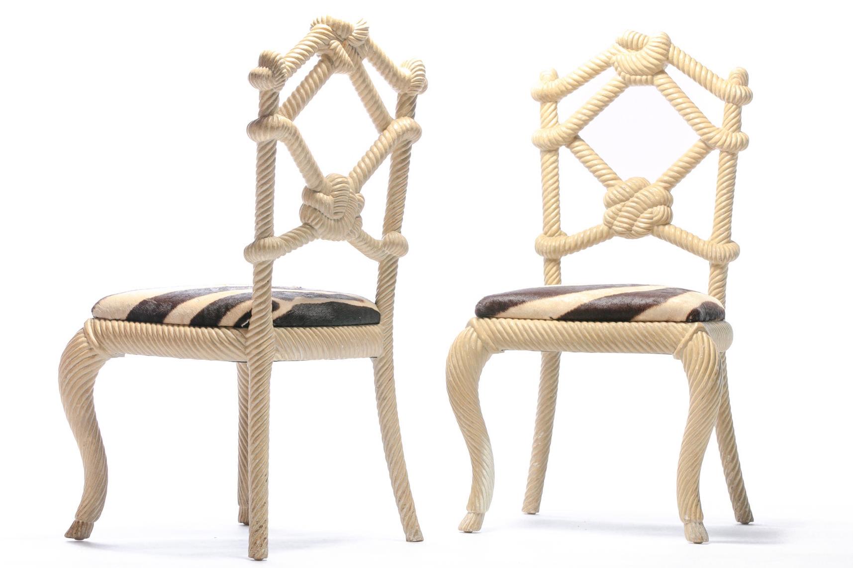 Whimsy and fantasy unite in this stunning pair of carved wood nautical rope form chairs freshly reupholstered in supple zebra hide. These rope chairs were selected by Interior Designer Kelly Wearstler for her project - Viceroy Miami, circa 2008.