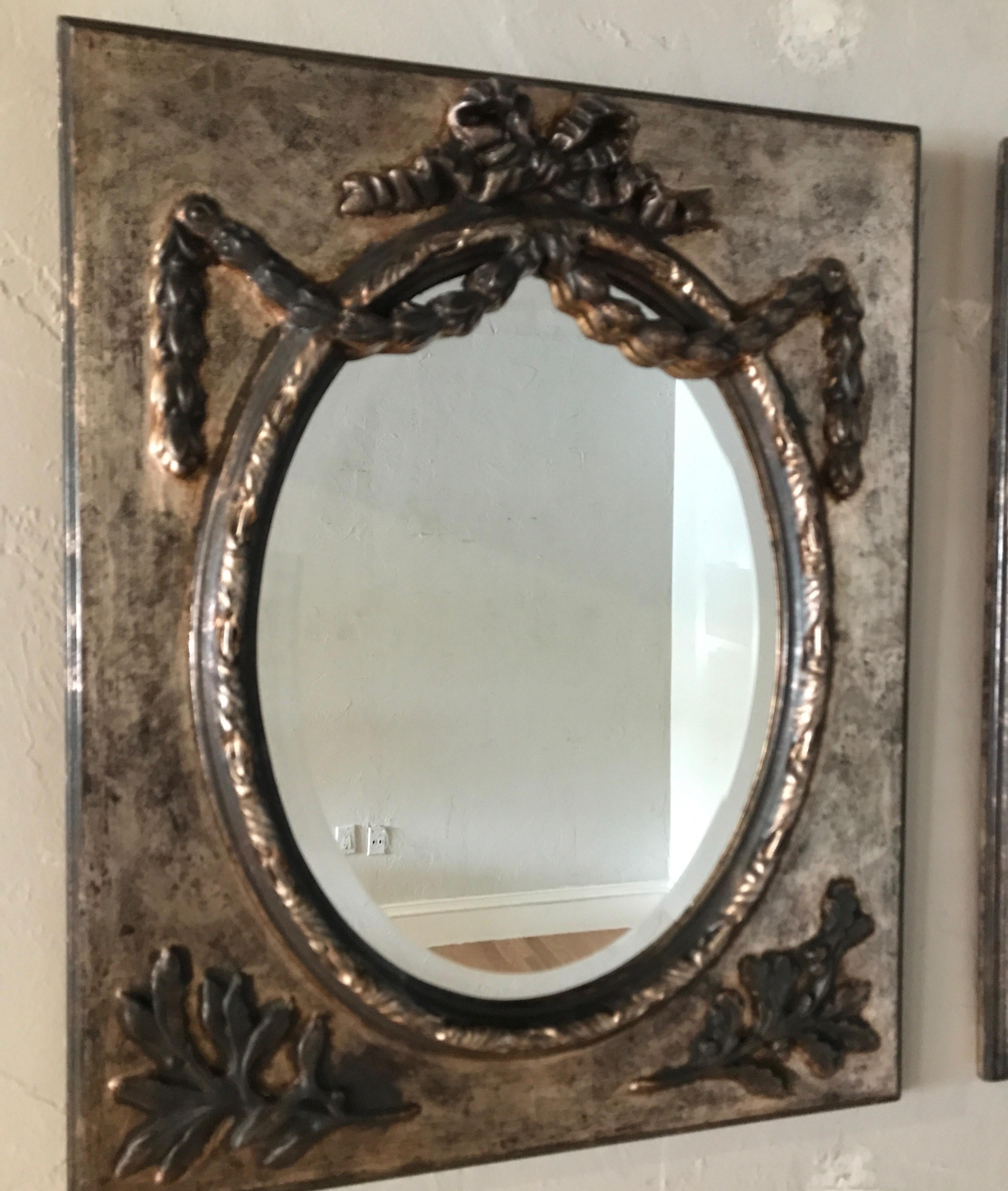 Pair of rope and swag giltwood mirrors.
