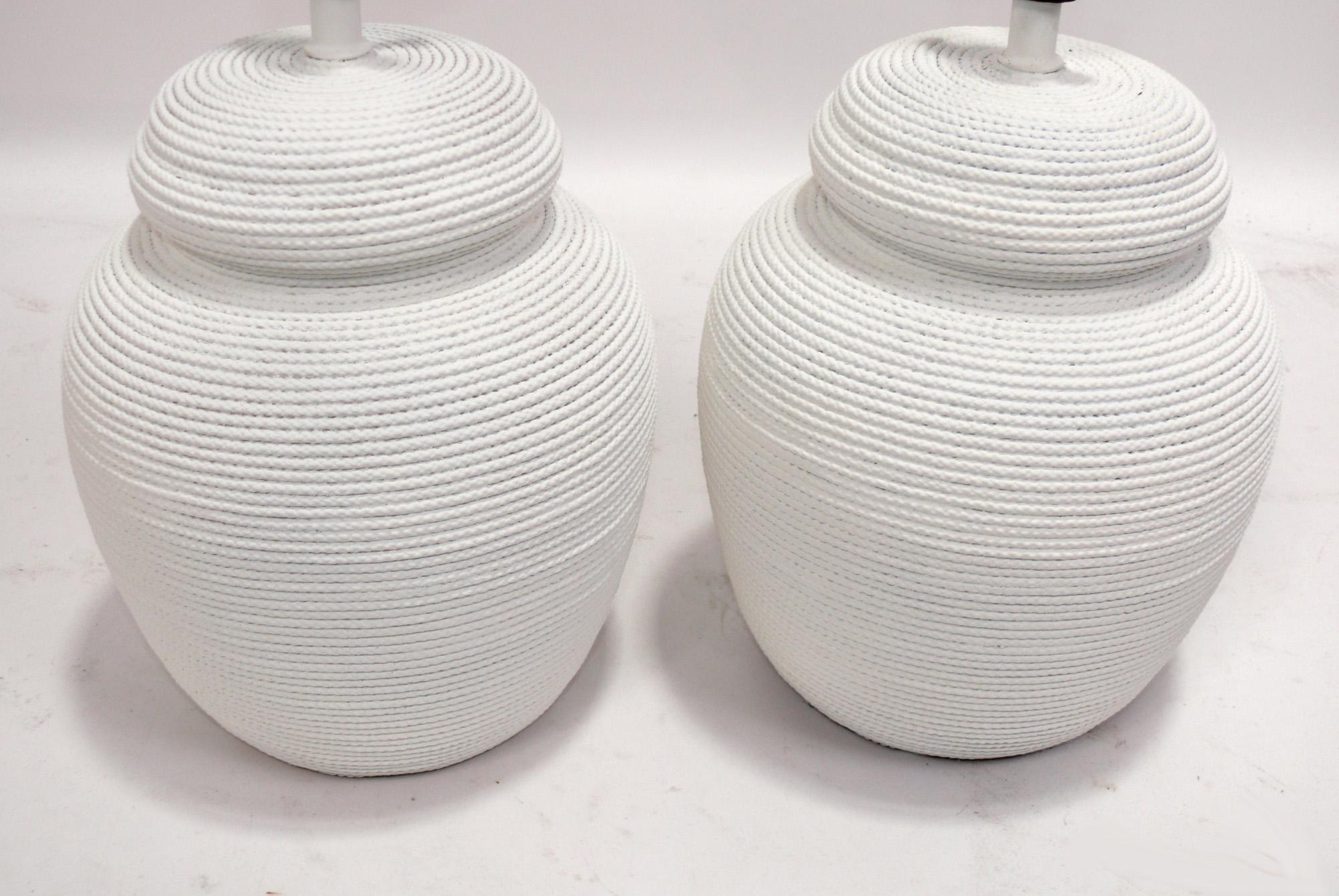 Pair of Rope Wrapped Form Ceramic Lamps, made by the S&M Lamp Company Inc., American, circa 1970s. Executed in a chalky white finish. They have been rewired and are ready to use, and the price noted includes the shades. 