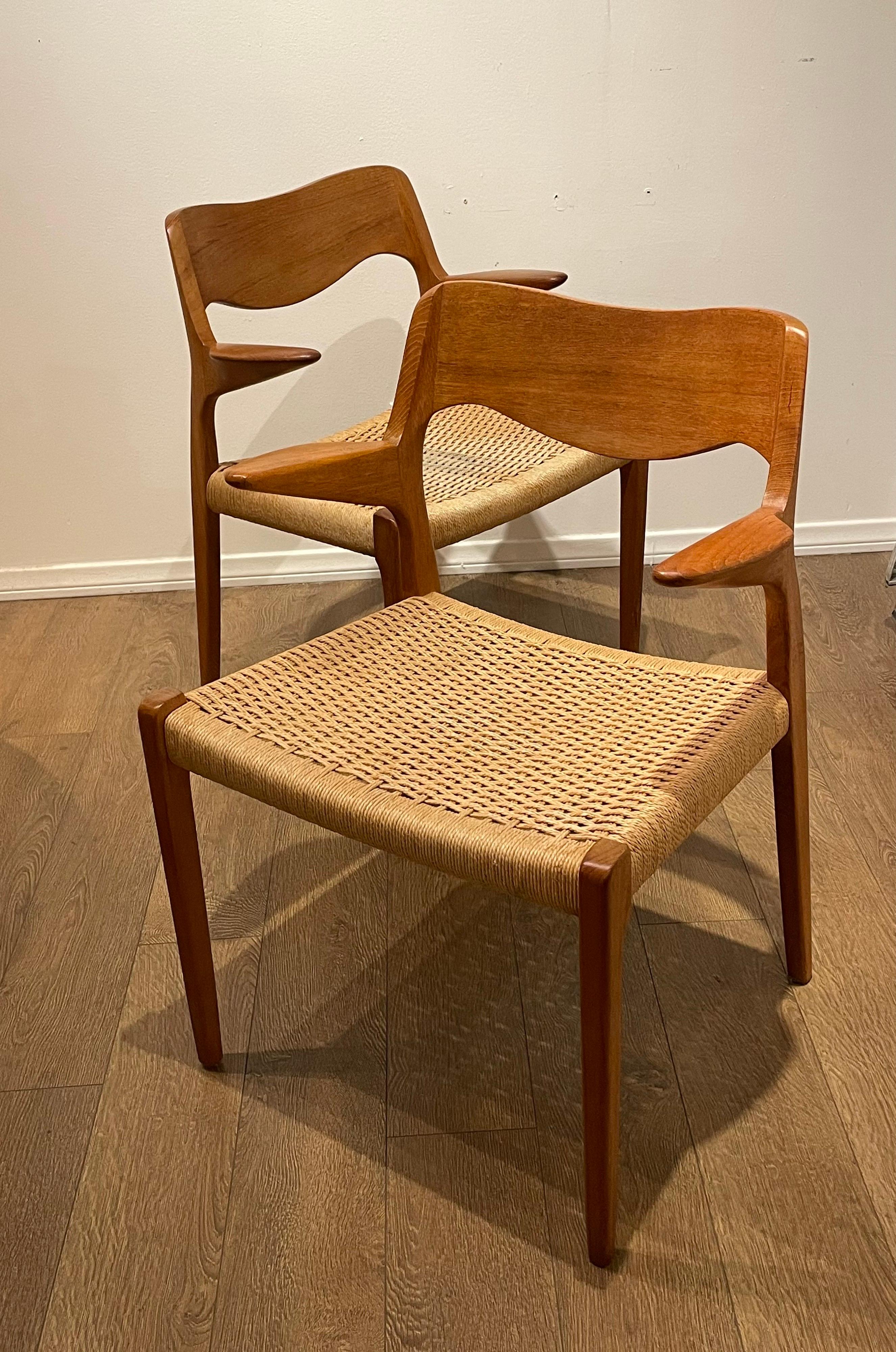 Set of (2) vintage Danish rope seat dining armchairs by Niels Otto Moller. The model 71 classic roped seat armchair has been an icon of Danish Modern design since its introduction by J.L. Moller. Take a look at the chairs from all angles. The back