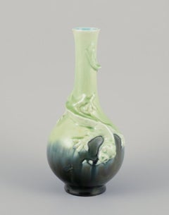 Pair of Rörstrand Art Nouveau faience vases. Relief motif of lizards.