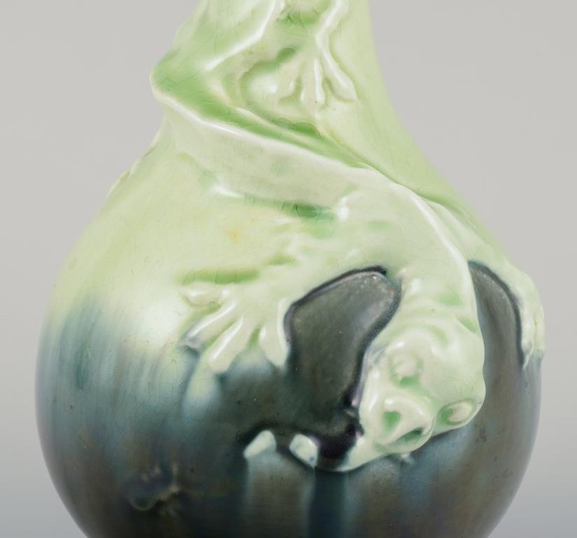 Swedish Pair of Rörstrand Art Nouveau faience vases. Relief motif of lizards. For Sale