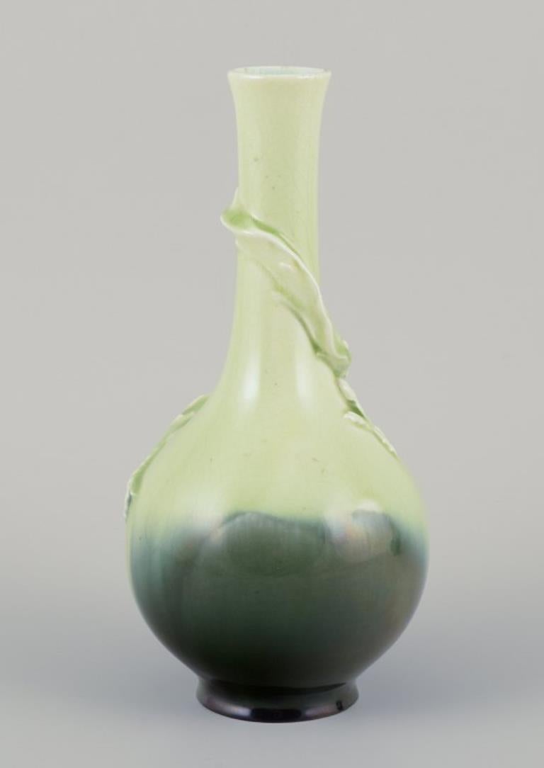 Faience Pair of Rörstrand Art Nouveau faience vases. Relief motif of lizards. For Sale