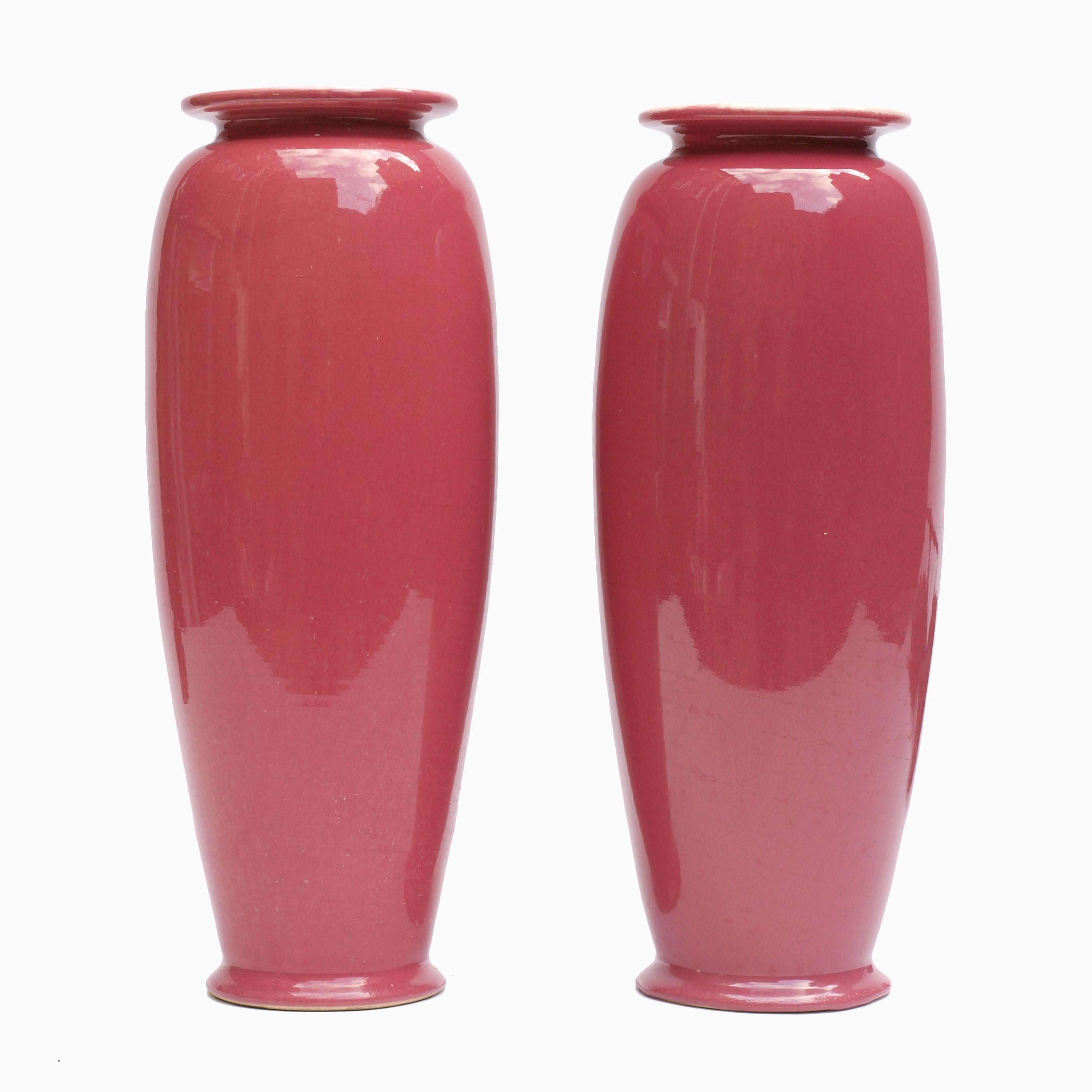 A beautiful pair of Christopher dresser urn shaped vases in a rich rose glaze with a cream interior. Ault pottery, owned by William Ault whom dresser designed for at the time would have produced these in the mid to late 1890s. Dresser’s clean shapes