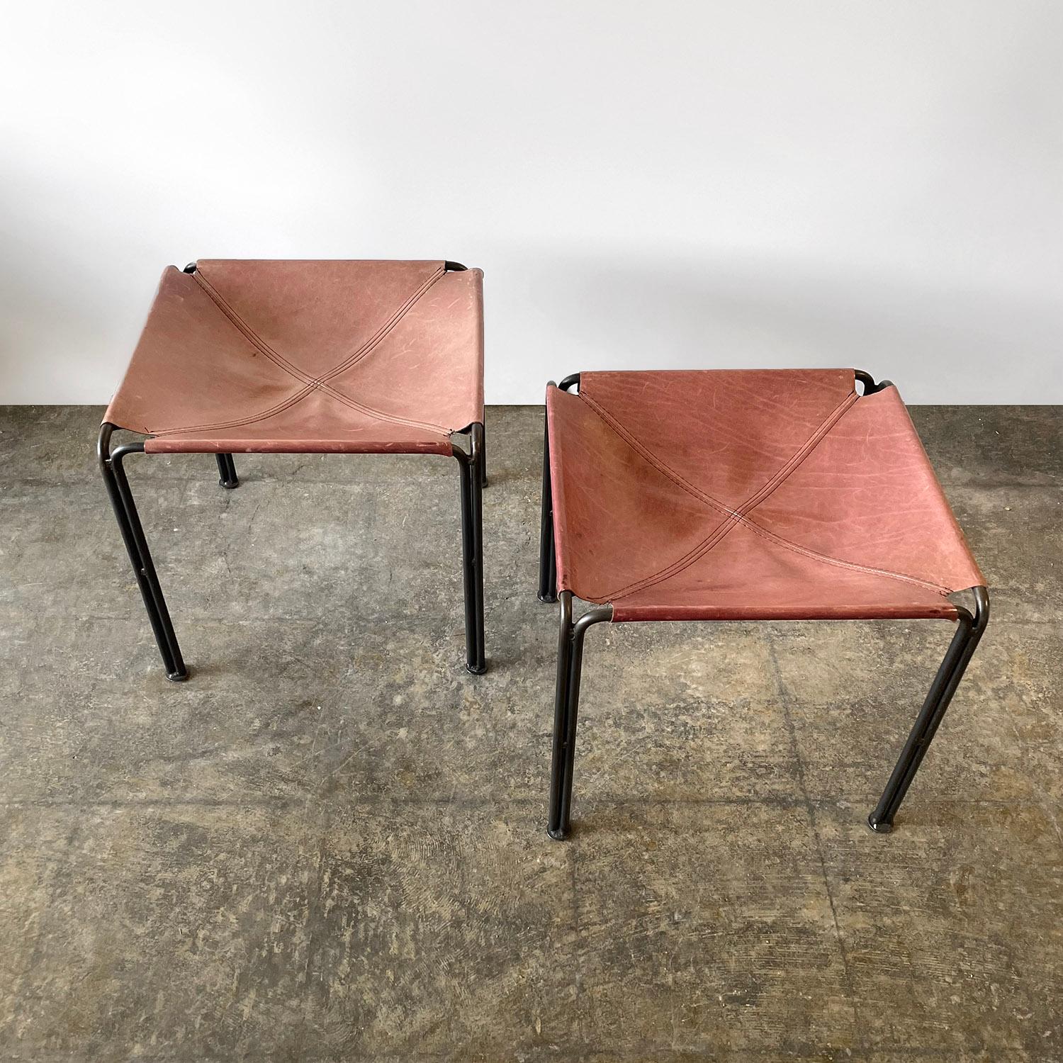 Rose leather & iron sling stools.
Soft rose tone leather stools are perfectly aged and worn in - each is uniquely distressed
Sleek bent iron frames.
Patina from age and use.