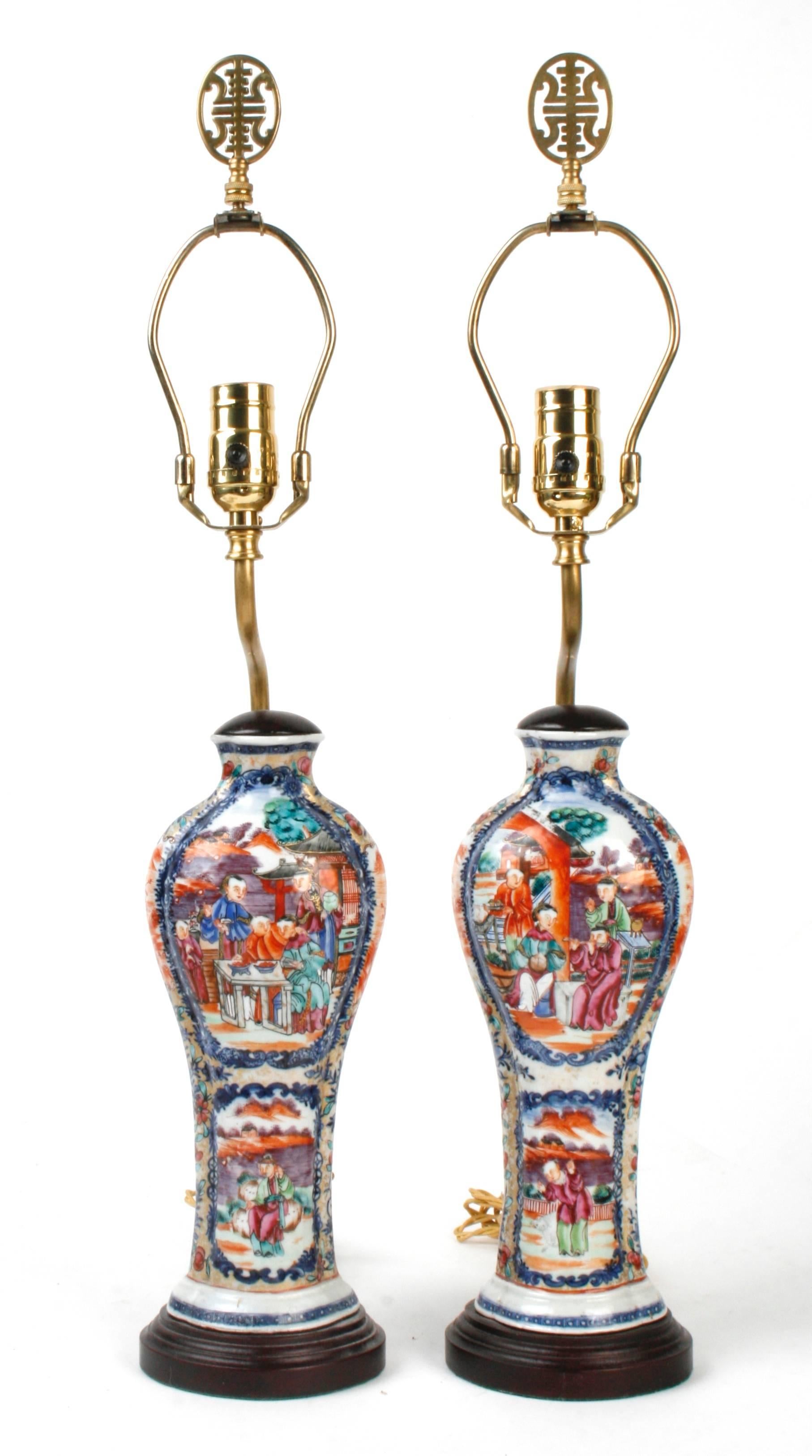 A pair of Rose Mandarin Chinese export vases now converted into lamps, c1800. The Chinese export vases are polychrome enameled in the Rose Mandarin pattern. Rose Mandarin is a variation on Rose Medallion, which shows only people in the panels. The