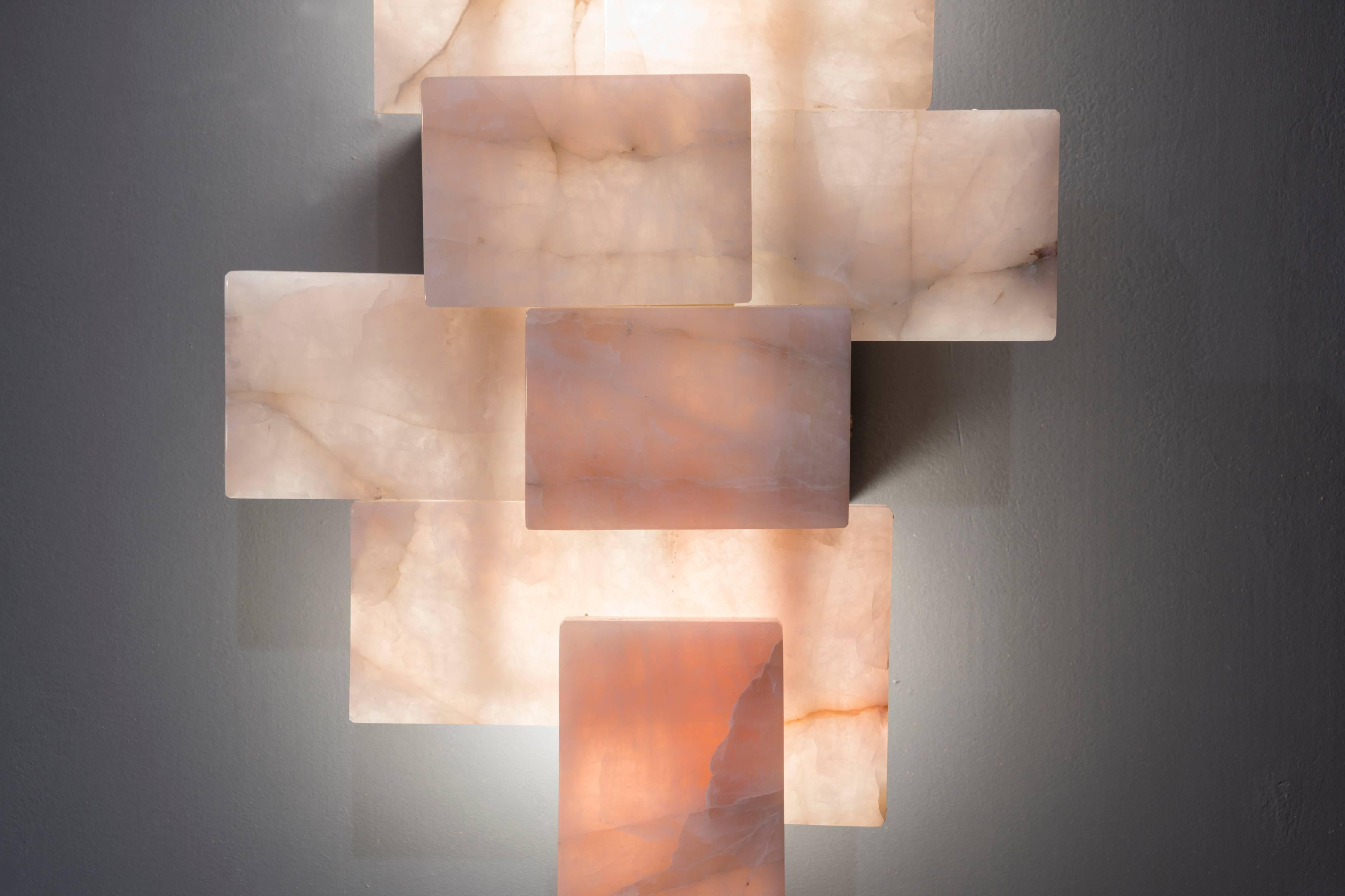 Pair of sconces in rose quartz, possibility to change and customize the size, LED bulbs system and brass structure.
Created by Studio Glustin in 2018.