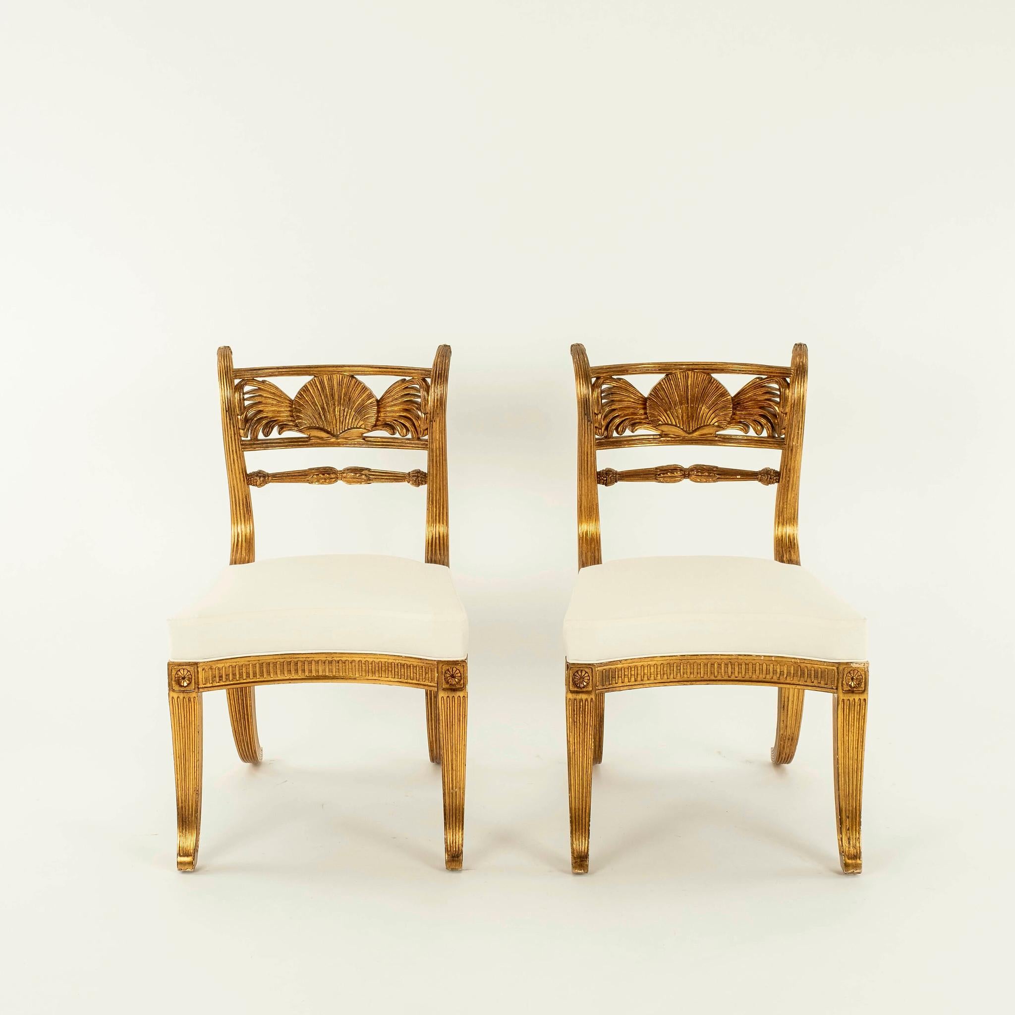 A pair of Rose Tarlow style Regency shell back chairs.