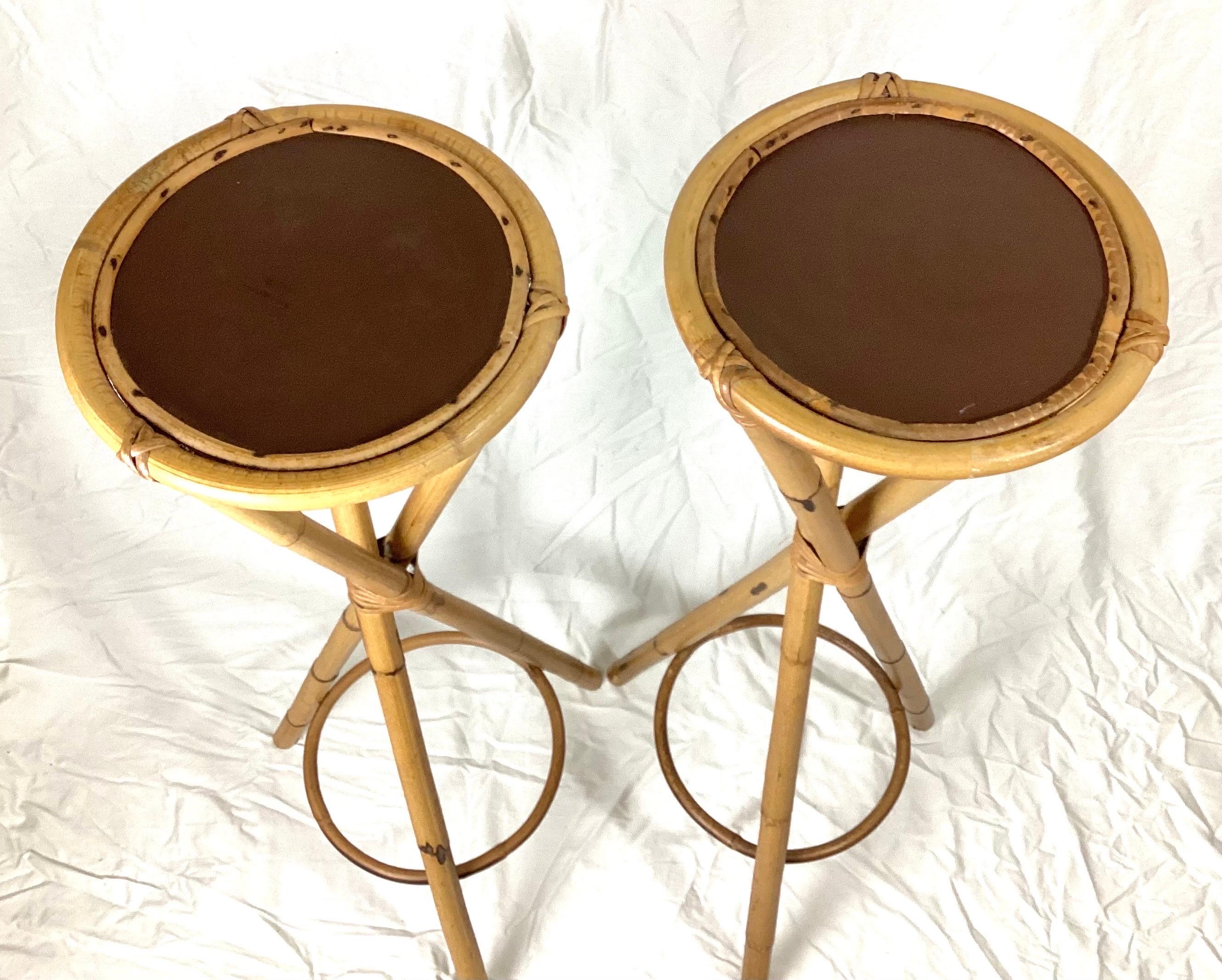 Pair of Rosenthal Netter bamboo display stands plant stands, Italy, 1950s. These stands stand 28.5” tall by 11.5” in diameter at the top. 17” diameter at the base. Original condition with some evidence of use at the feet and some water marks on the