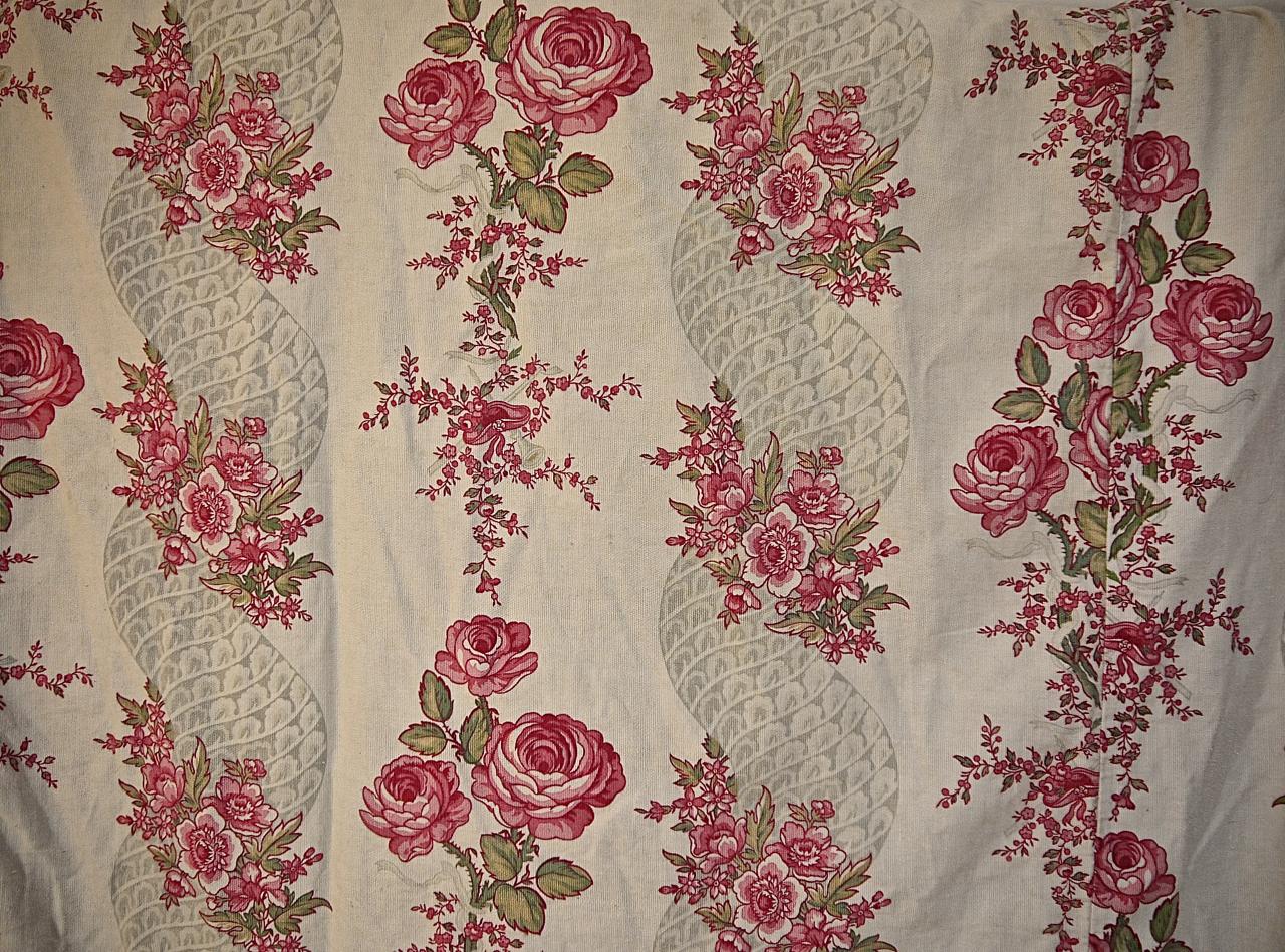Large pair of French cotton curtains with a pretty design of rows of roses alternating with soft grey twisting columns. Original use was perhaps for a ciel du lit or a lit a la polonaise. The curtains may have folded back on themselves as there are