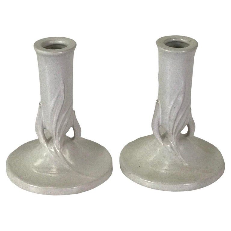 Pair of “IVORY” candlesticks, Model no. #1122-5 by Roseville Pottery from the 1940s. Decorated in relief with a leaf motif and glazed in satin white. Candleholders from Roseville. Just beautiful !

Very Good Condition. No issues.

Measurements: