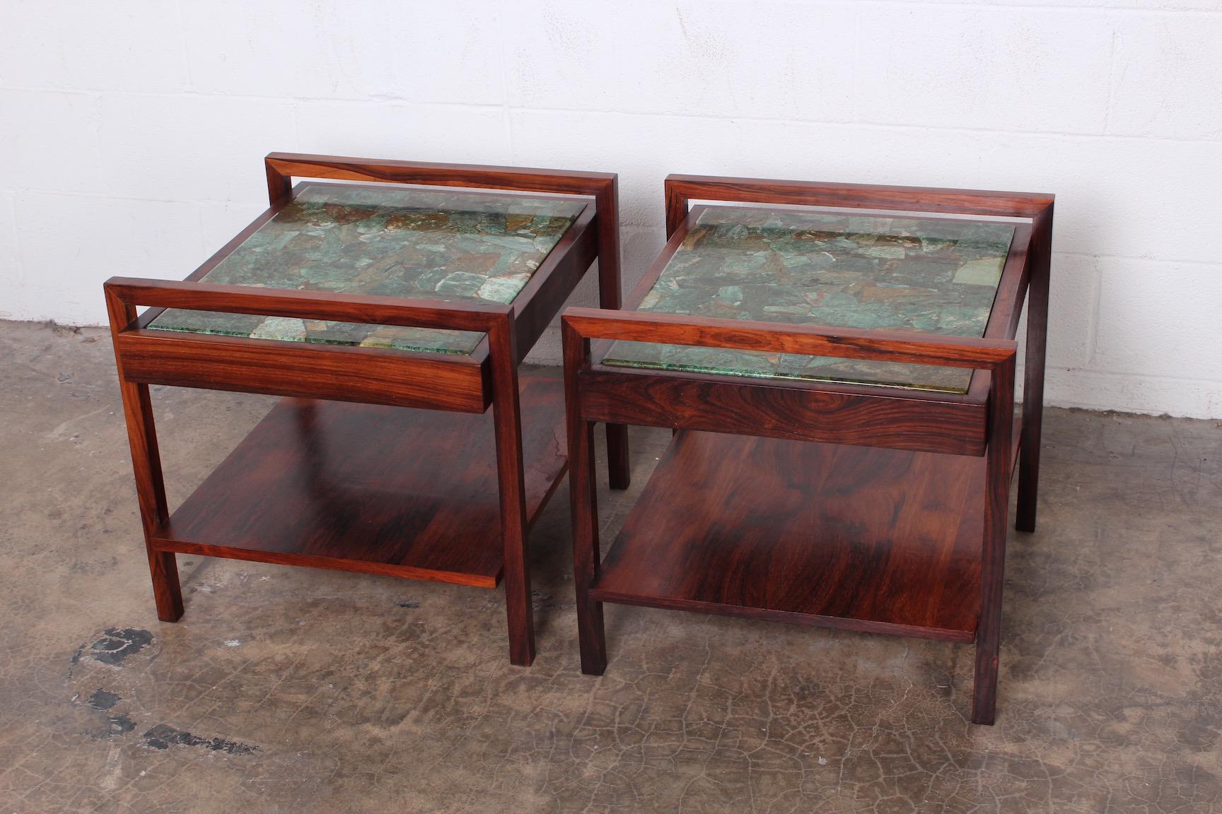 A beautiful pair of solid rosewood tables with green agate tops.
