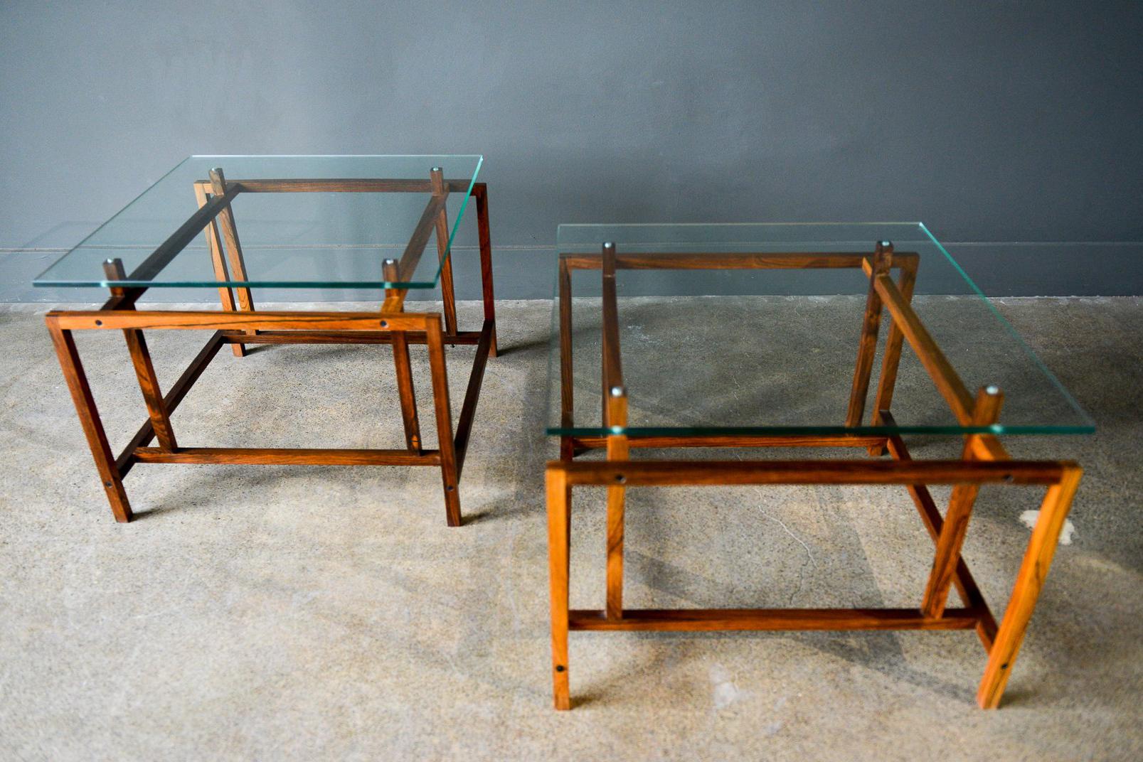 Pair of rosewood and glass side tables by Henning Norgaard, circa 1965. Delicate lattice style rosewood frames with original notched glass tops in very good vintage condition. 

Measures 19.5