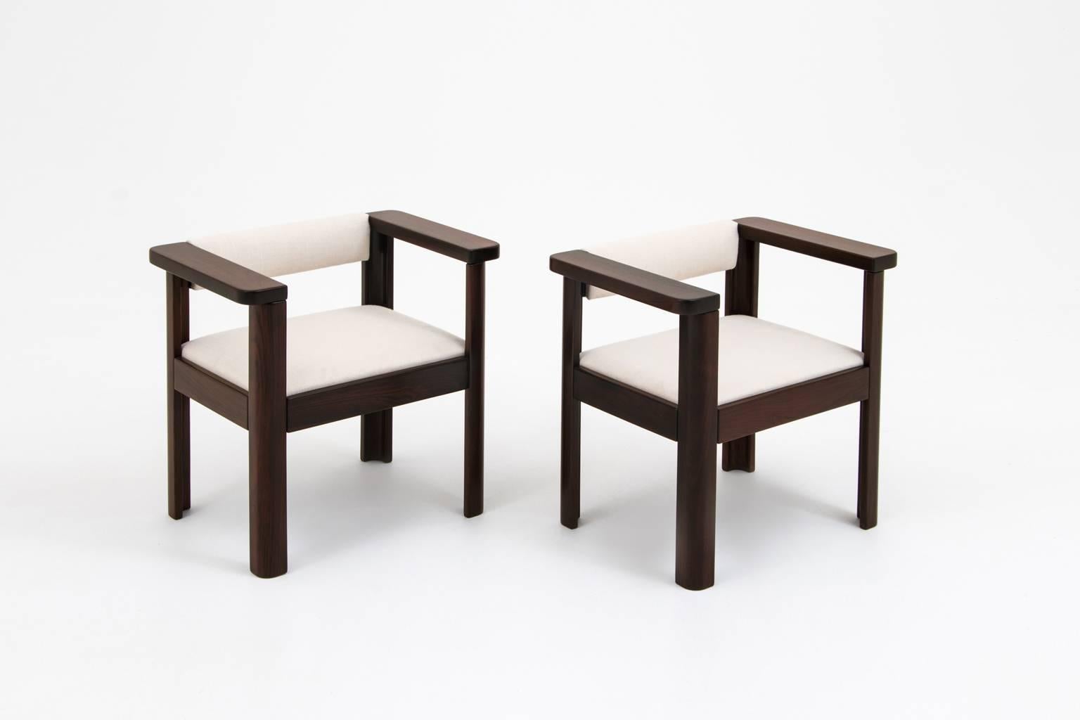 Pair of armchairs mod. ‘Idlor’ by Angelo Mangiarotti for Lorenzon, Italy 1960’s. 
Strong sculptural design made out of solid Rosewood. Upholstered with a luxurious woven 100% natural fabric composed of Viscose (Rayon) and silk from the collection of