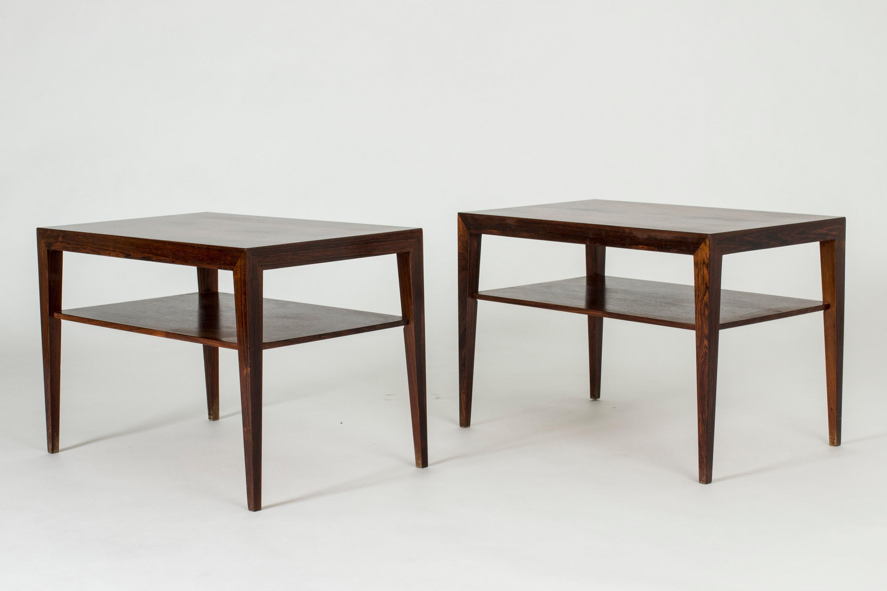 Pair of rosewood bedside tables by Severin Hansen with one shelf under each table top. Beautiful veneer and Severin Hansen’s characteristic diagonal, seamless joinery at the corners.