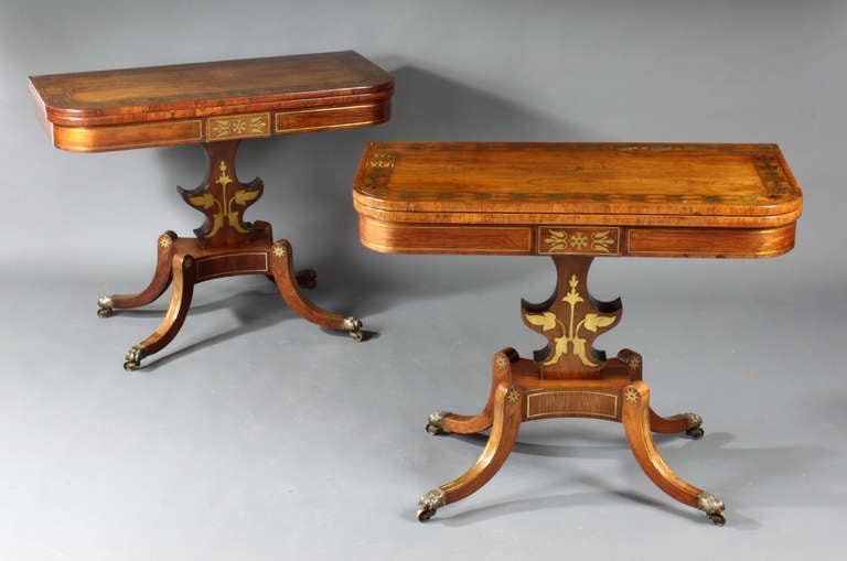 A fine pair of Regency card tables, the tops and friezes with delicate brass inlays; good pale color.