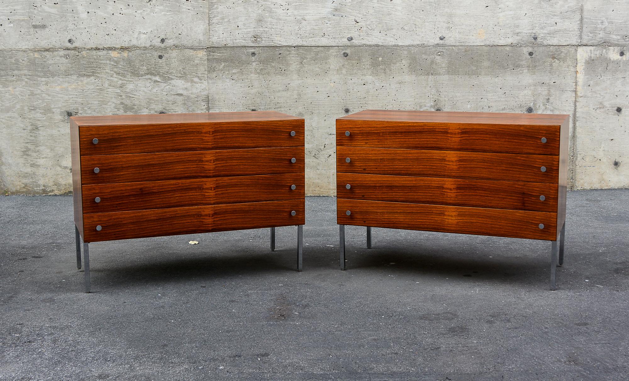 Pair of rosewood dressers designed by Poul Norreklit. These were made by Sigurd Hansen Mobelfabrik of Denmark. The legs and handles are chrome plated. The grain on the rosewood is outstanding. These have been refinished. Contact us for better