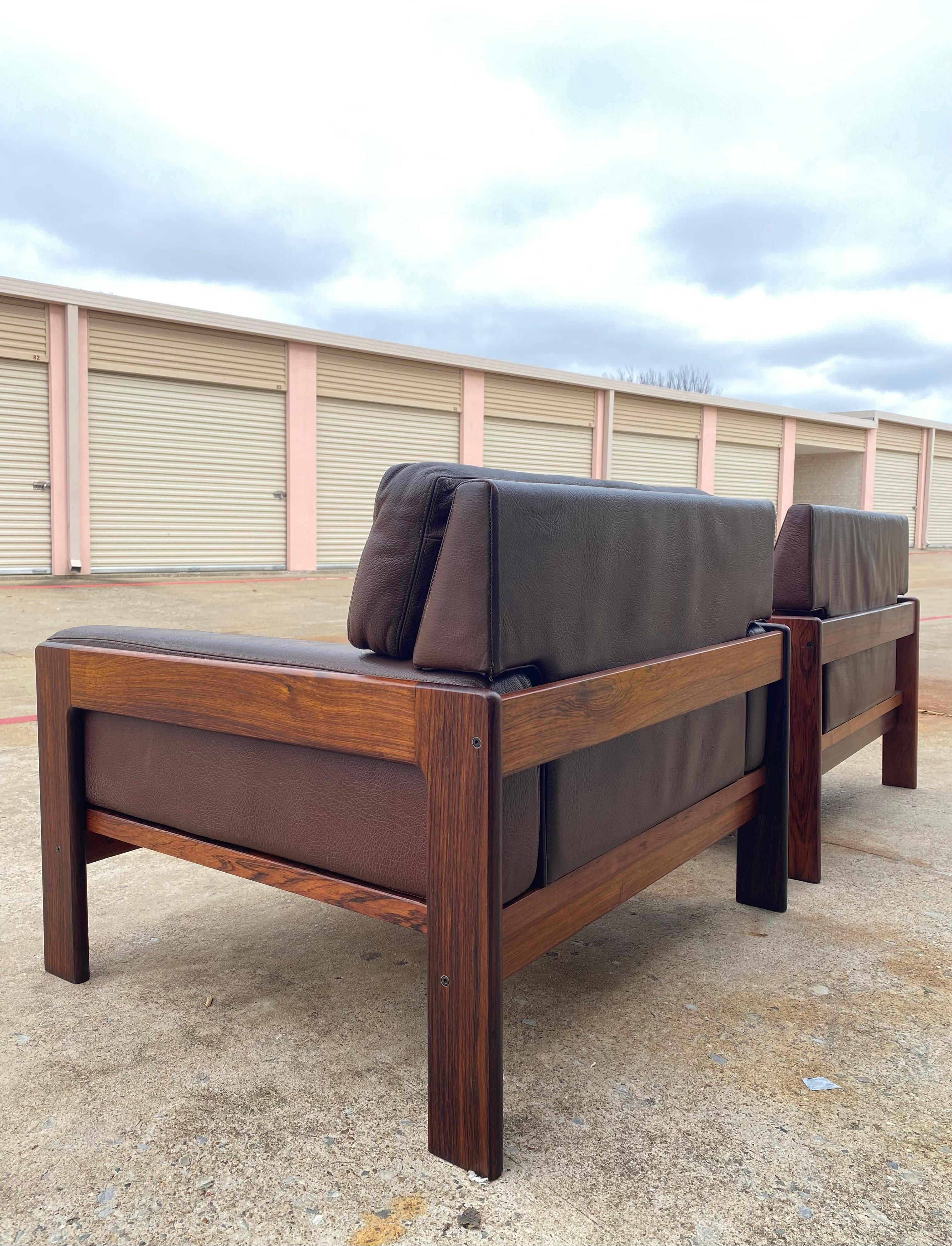 Danish Modern pair of lounge chairs in original brown pebbled leather and rosewood. Designed by Henry Walter (H.W.) Klein for Bramin, 1970s

Originally known as N.A. Jørgensen, Danish furniture manufacturer Bramin was founded in Bramming, a region