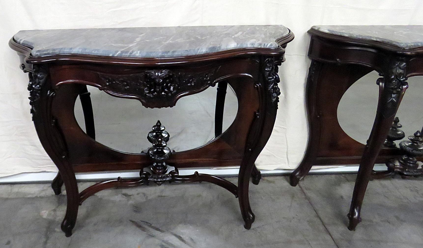 Pair of rosewood marble top, mirrored console tables with matching mirrors. The console tables measure 37