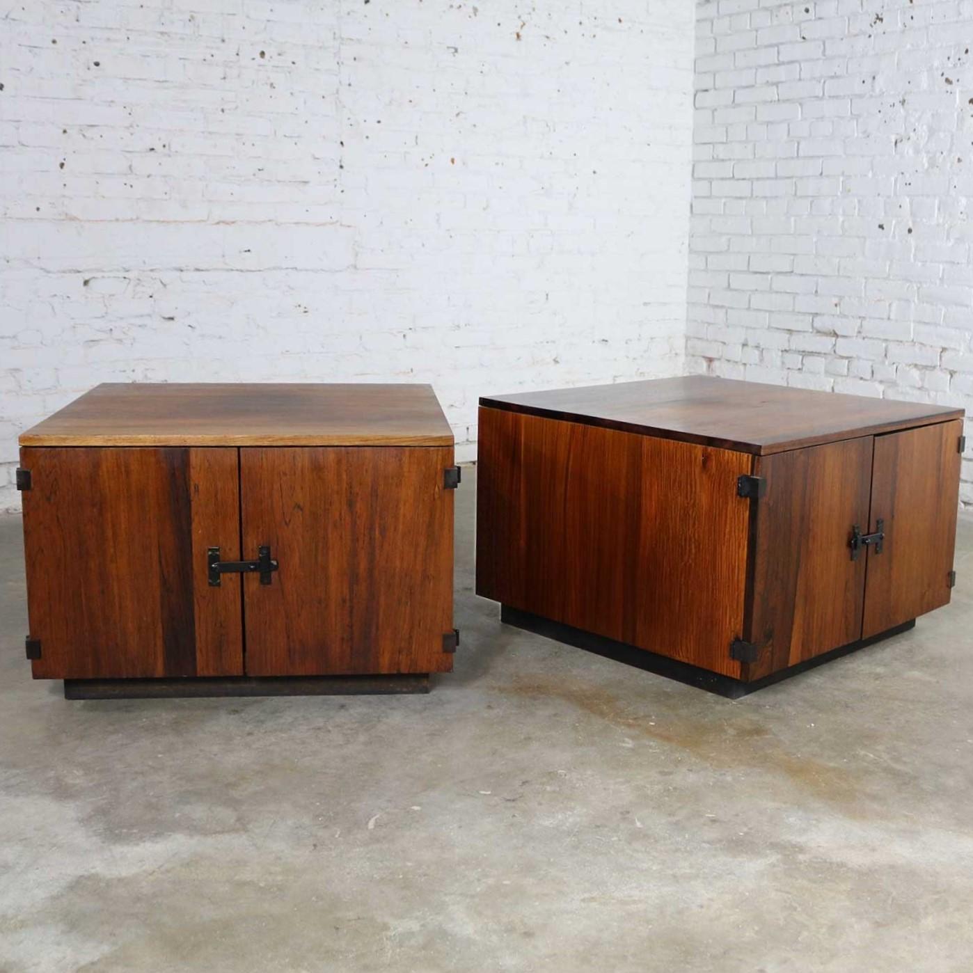Handsome pair of Mid-Century Modern square cabinet style end tables or side tables in gorgeous rosewood. They are in wonderful vintage condition and ready to use. There are some darker spots on the tops and around door latches from use. Please see