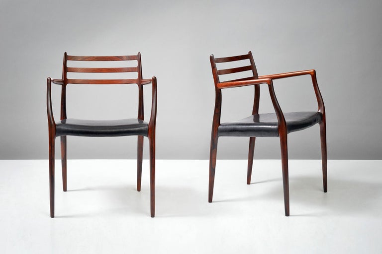 Niels Moller

Model 62 armchair, 1962

Rosewood armchairs designed by Niels Moller for J.L. Moller Mobelfabrik, Denmark, 1962. Black aniline leather seats.

Measures: H 80cm, D 55cm, W 56cm.
 