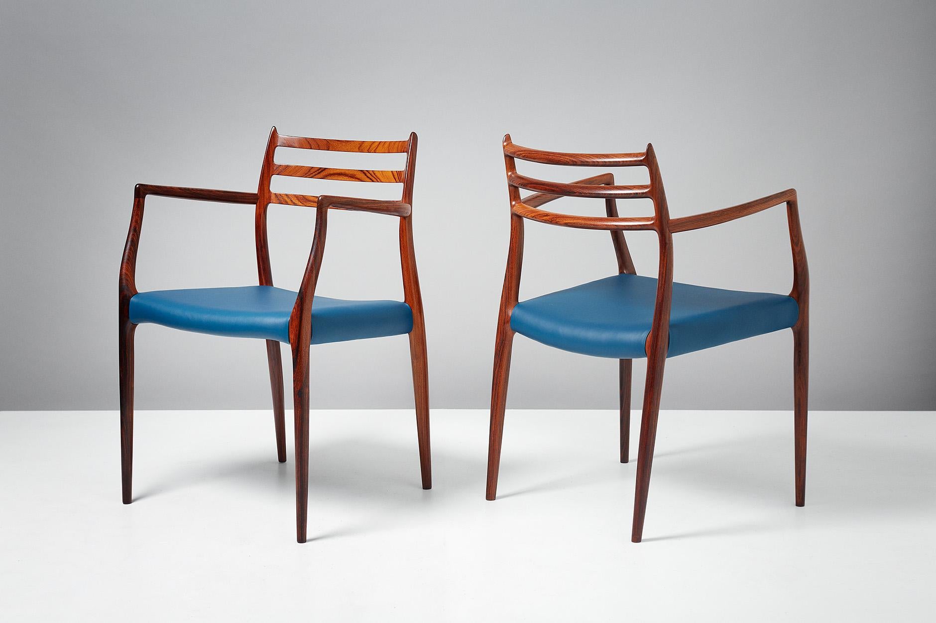 Niels Moller

Pair of model 62 armchairs, circa 1962

Rosewood armchairs designed by Niels Moller for J.L. Moller Mobelfabrik, Denmark, 1962 with new majolica blue leather seats. These examples are early productions featuring more slender frames